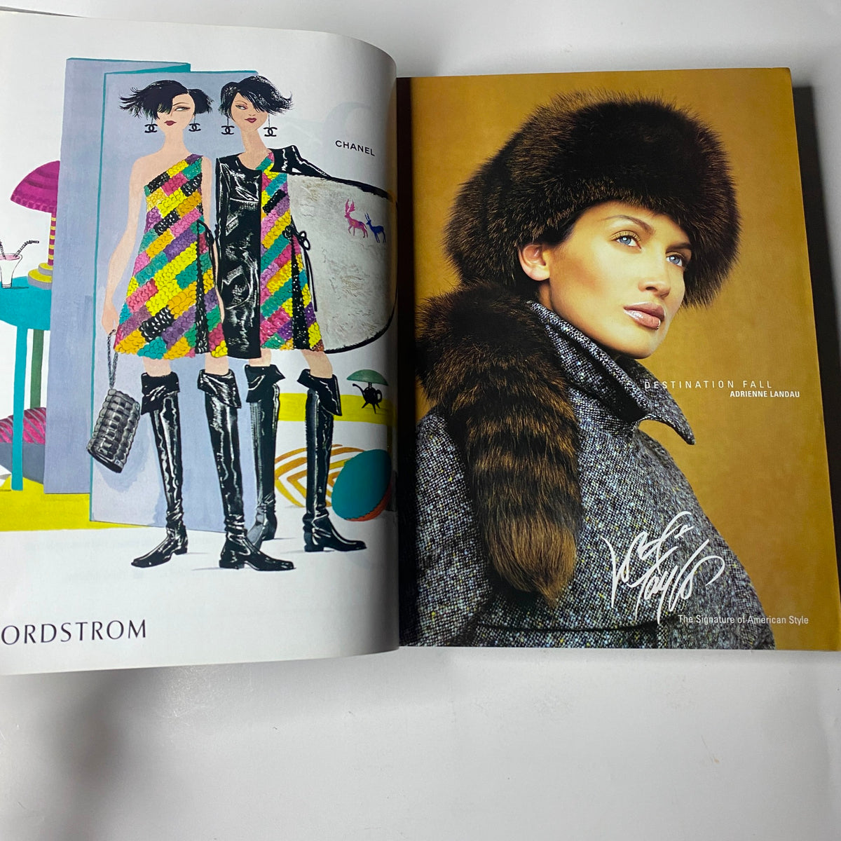 Vogue Magazine September 2001 features a stylish spread with colorful fashion illustrations including Chanel apparel and striking fur accessories, embodying the essence of high fashion.