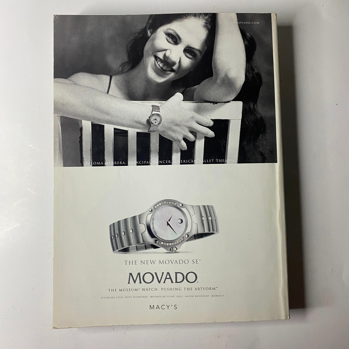 Vogue Magazine September 2000 Bridget Hall Cover back featuring a Movado advertisement with a woman showcasing a stylish watch, promoting the brand's luxury collection.