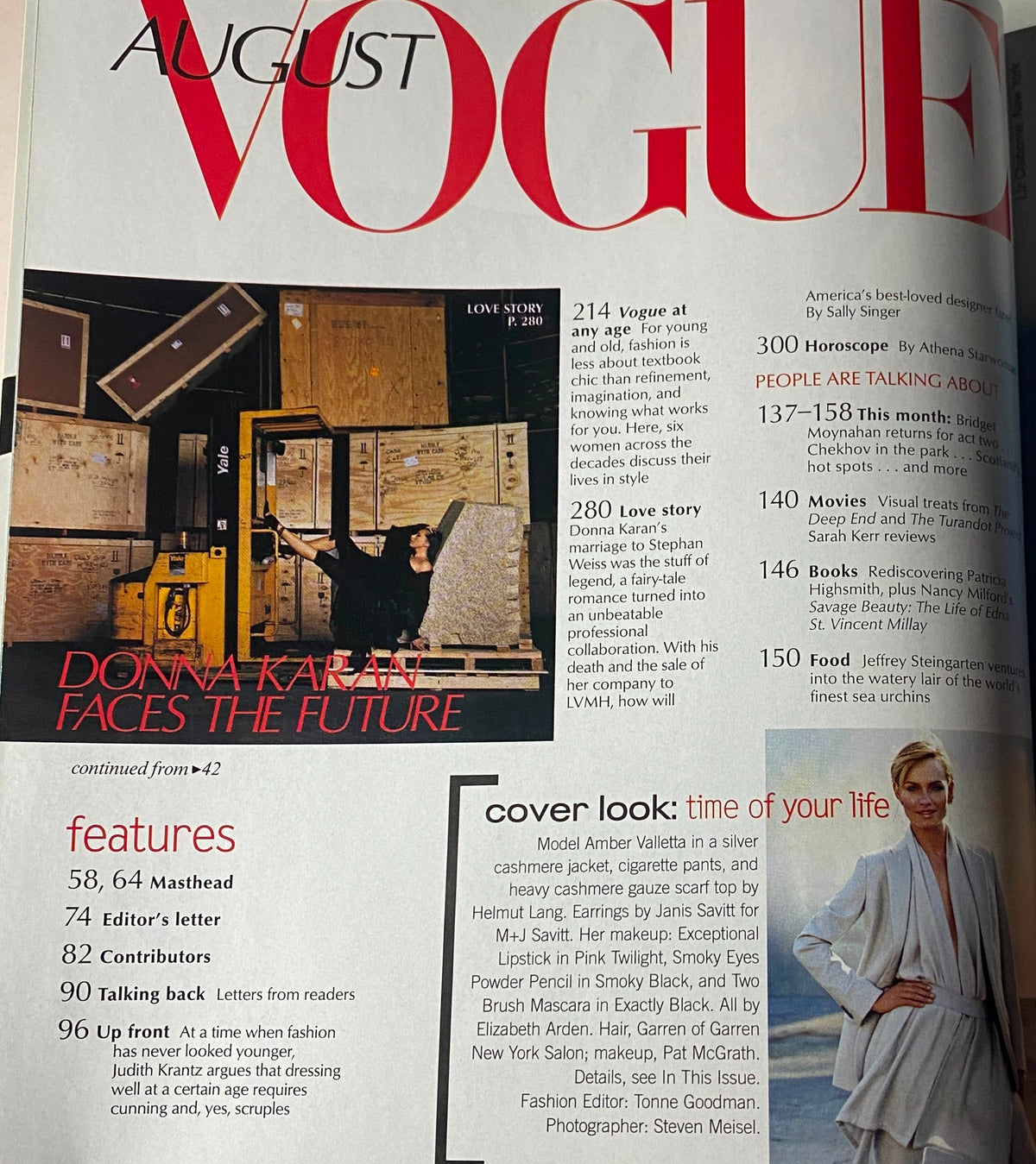 Inside page of Vogue Magazine August 2001 featuring the segment 'Love Story' which discusses Donna Karan's contributions to fashion, along with insights about the cover girl Amber Valletta.