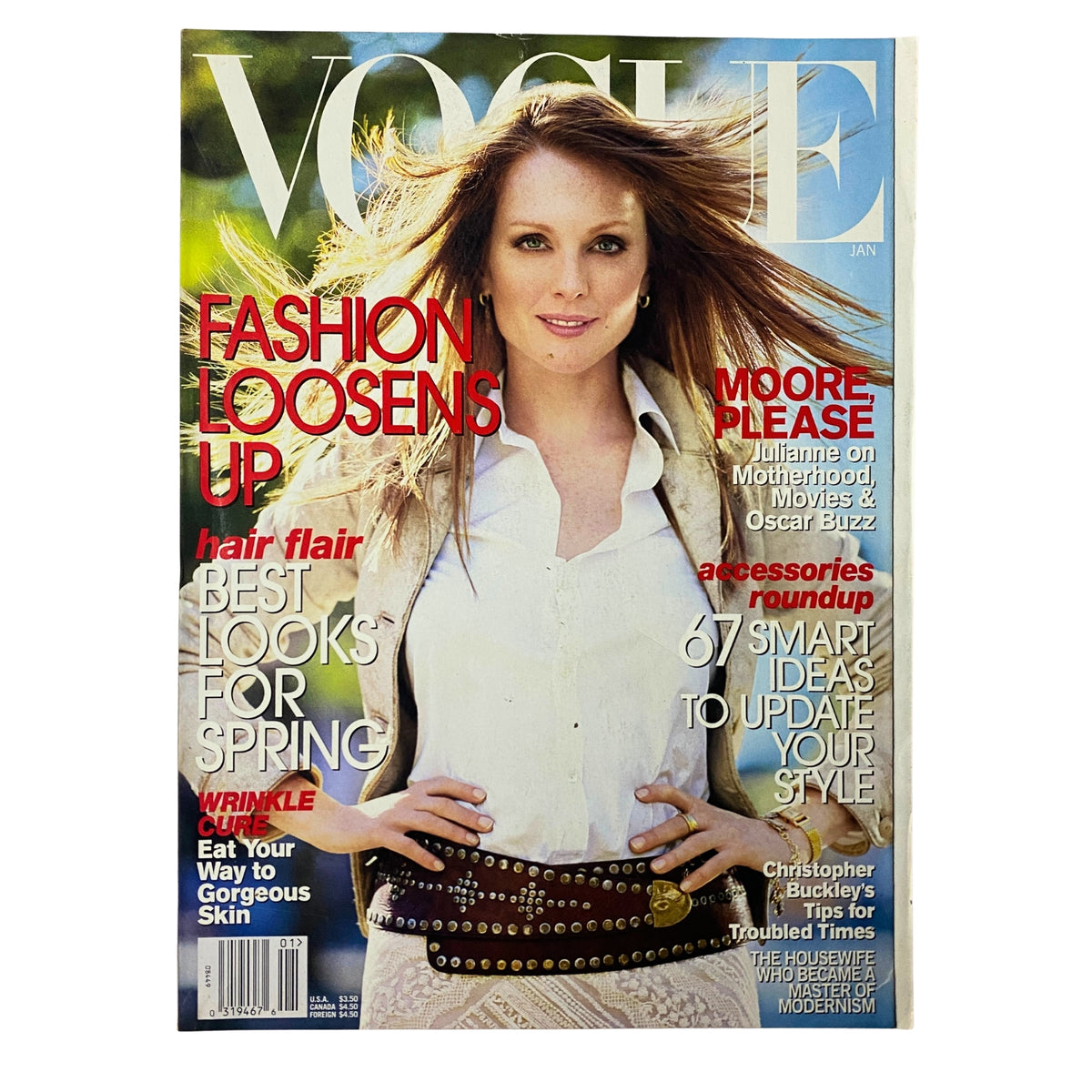 Vogue Magazine January 2002 featuring actress Julianne Moore on the cover, showcasing fashion trends for spring and style advice, in very good condition.