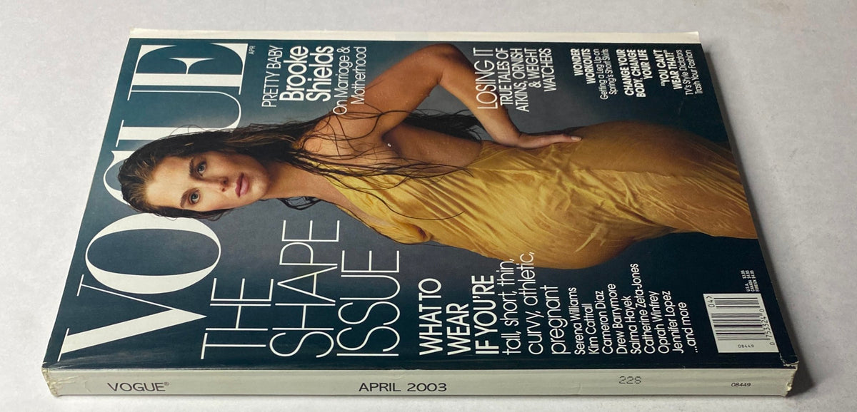 Close-up of the April 2003 Vogue Magazine cover with Brooke Shields, showcasing her in a vibrant yellow dress, emphasizing the magazine's focus on pregnancy and style.
