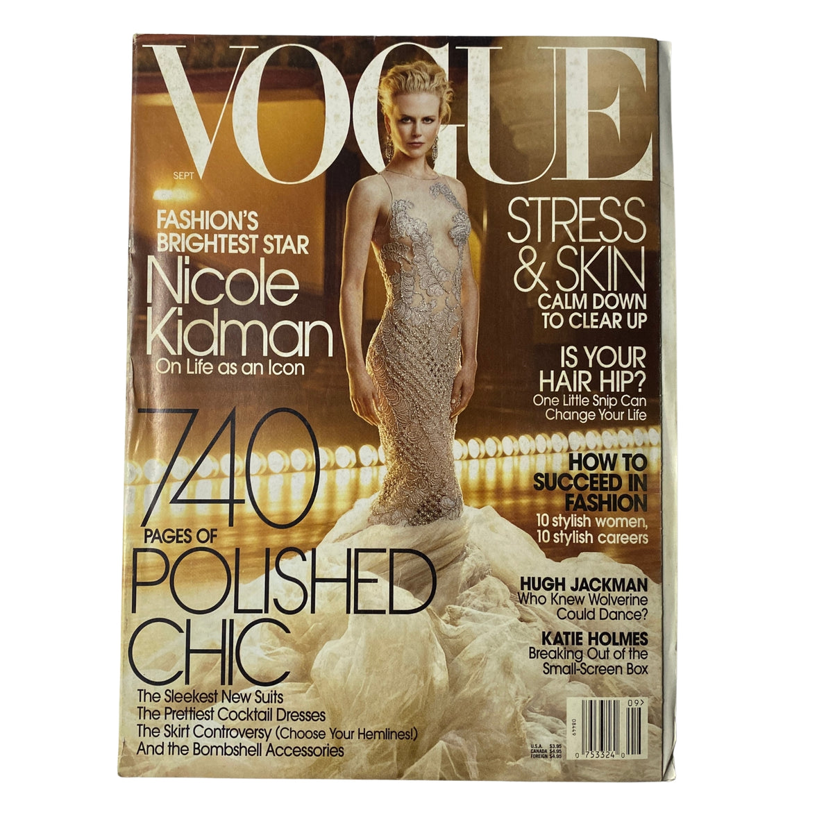 Cover of Vogue Magazine September 2003 featuring Nicole Kidman as the main cover star, dressed in a stunning gown, promoting her status as a fashion icon with the title 'FASHION'S BRIGHTEST STAR'.