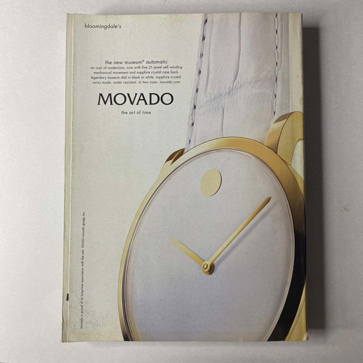 Cover advertisement for Movado showcasing a minimalist gold watch design, featured in Vogue Magazine September 2003 Nicole Kidman Cover No Label VG.