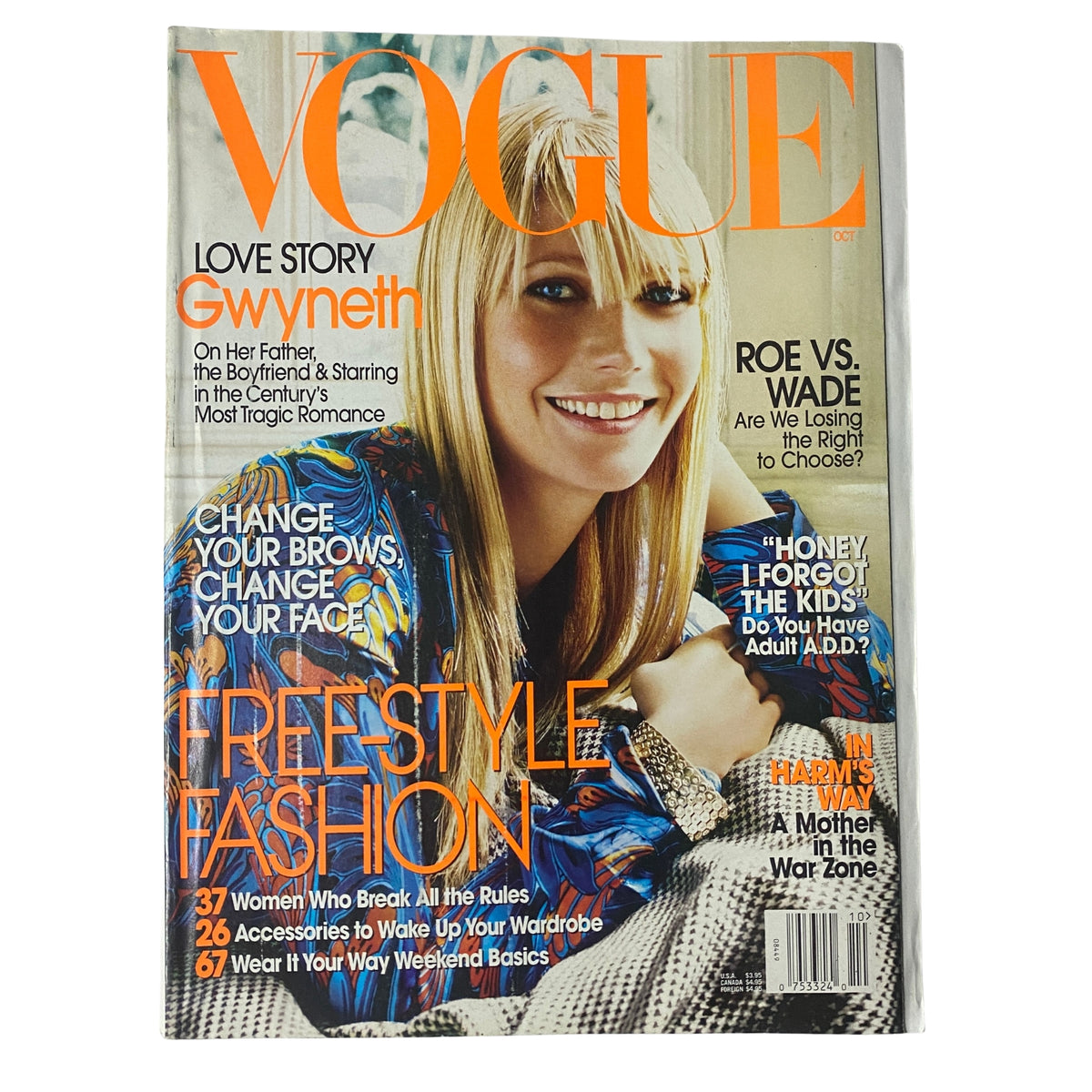 Vogue Magazine October 2003 cover featuring Gwyneth Paltrow styled in a vibrant outfit, highlighting themes of fashion and beauty.