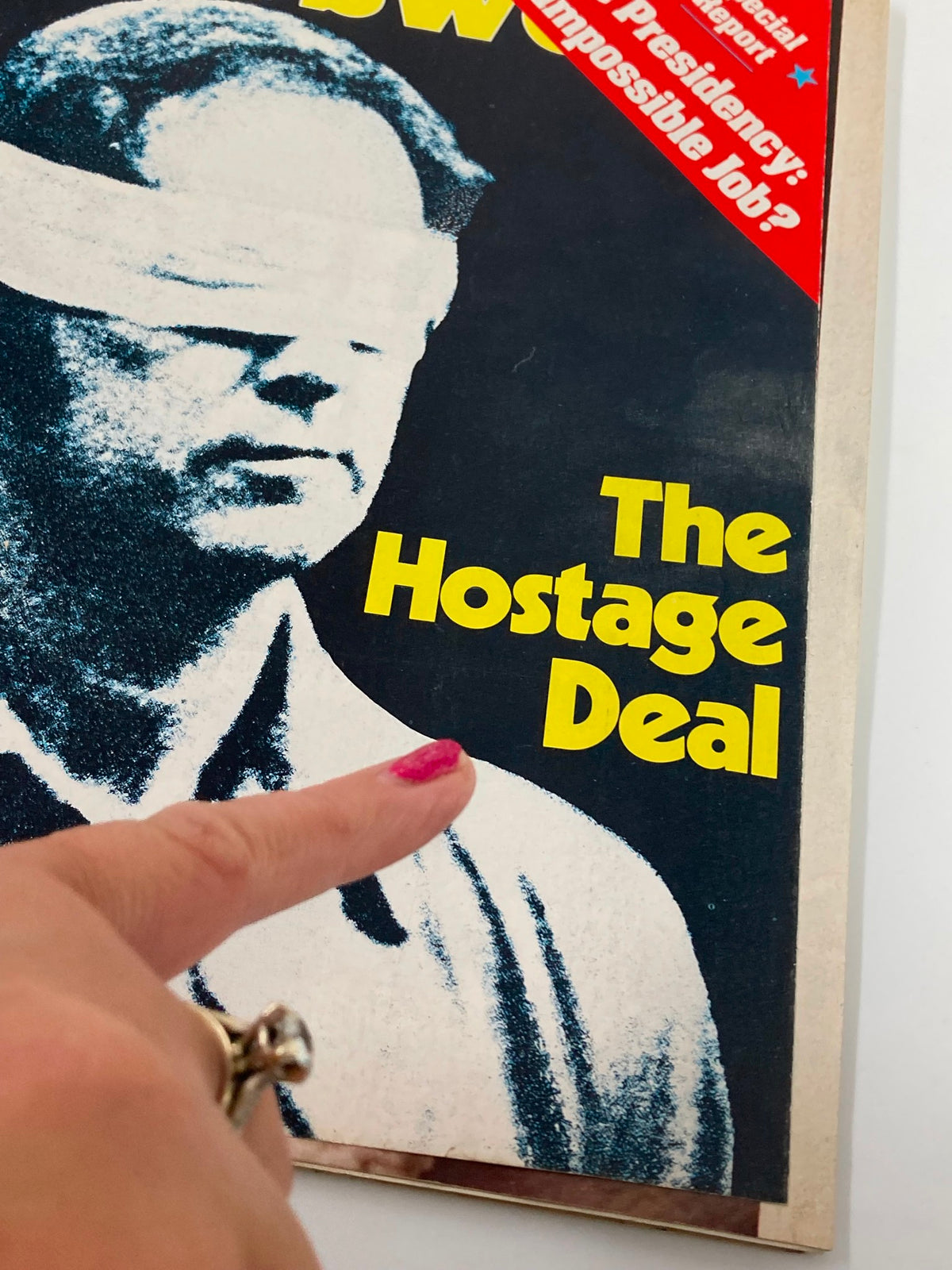 Close-up of VTG Newsweek Magazine January 26 1981 cover highlighting 'The Hostage Deal' with a finger pointing to the text.