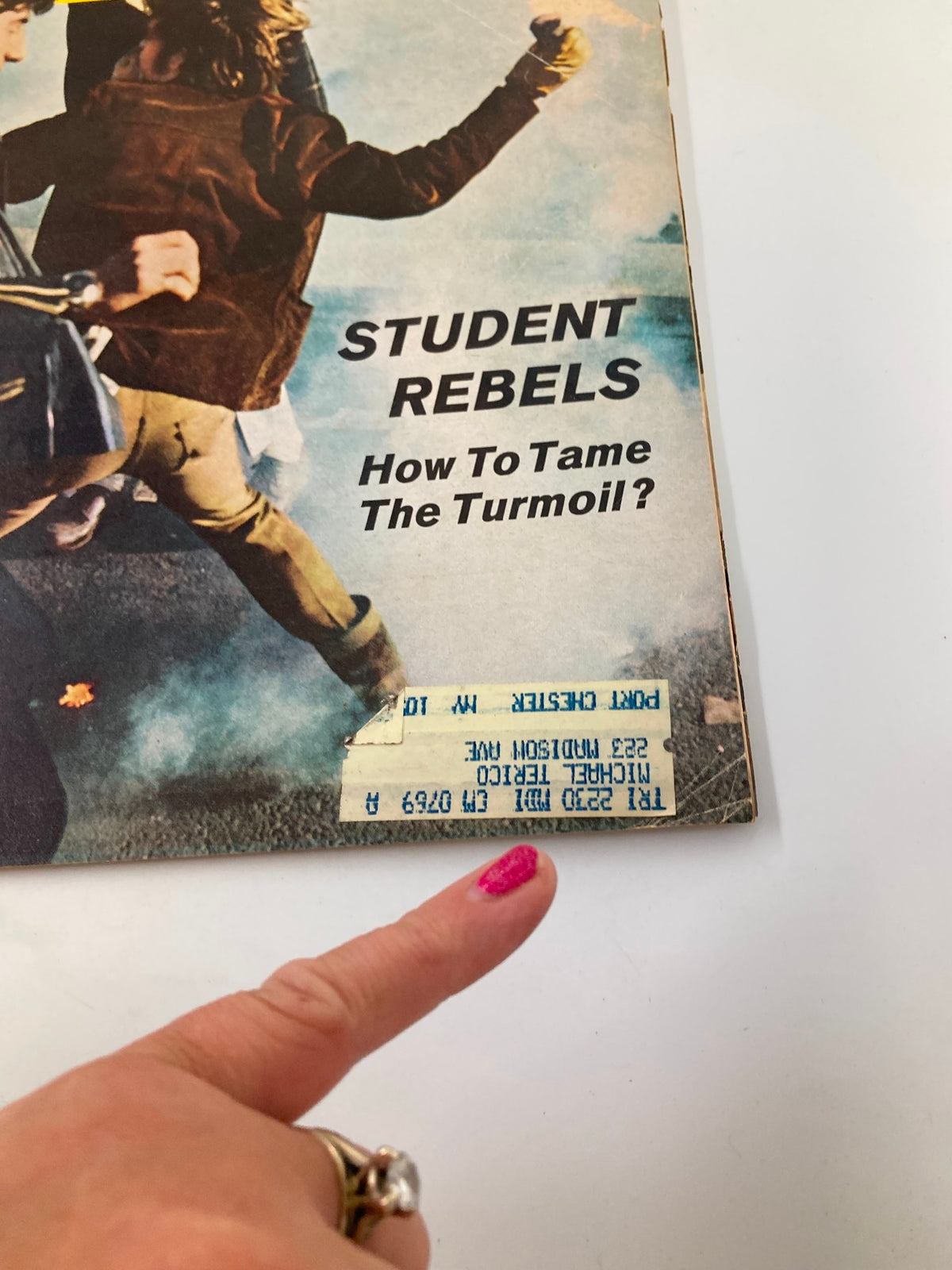 Close-up view of the cover of the VTG Newsweek Magazine March 10 1969 with the title 'STUDENT REBELS: How To Tame The Turmoil?' and a finger pointing at the bottom features.