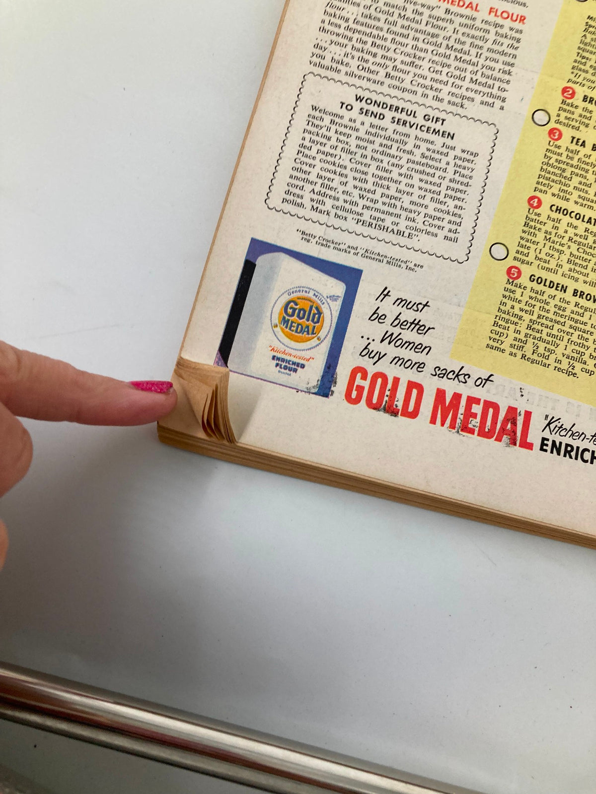 Detailed view of the back cover of the October 1951 Farm Journal Magazine with information about Gold Medal flour alongside a Betty Crocker advertisement for brownies. The image highlights package design and delivers a nostalgic appeal.