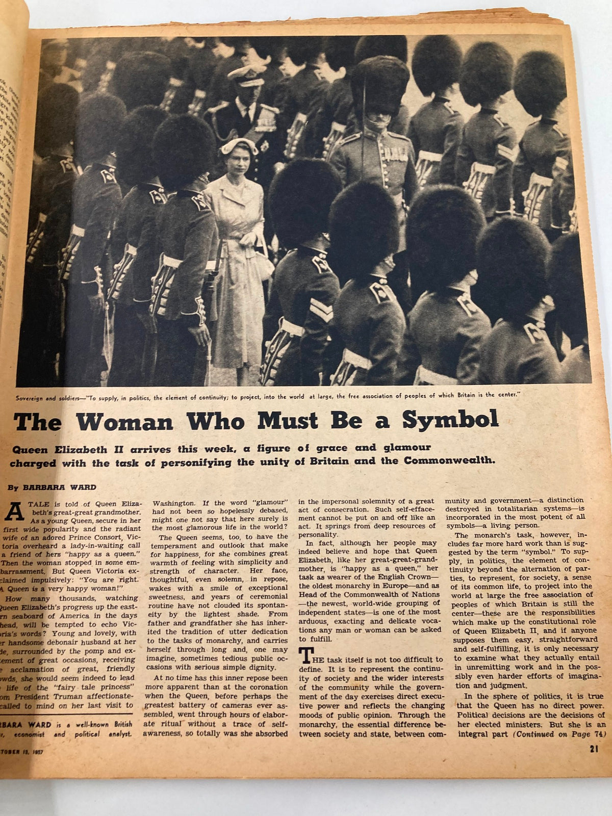 VTG The New York Times Magazine October 13 1957 featuring Queen Elizabeth II surrounded by military personnel, showcasing a historic moment of grace and glamour.