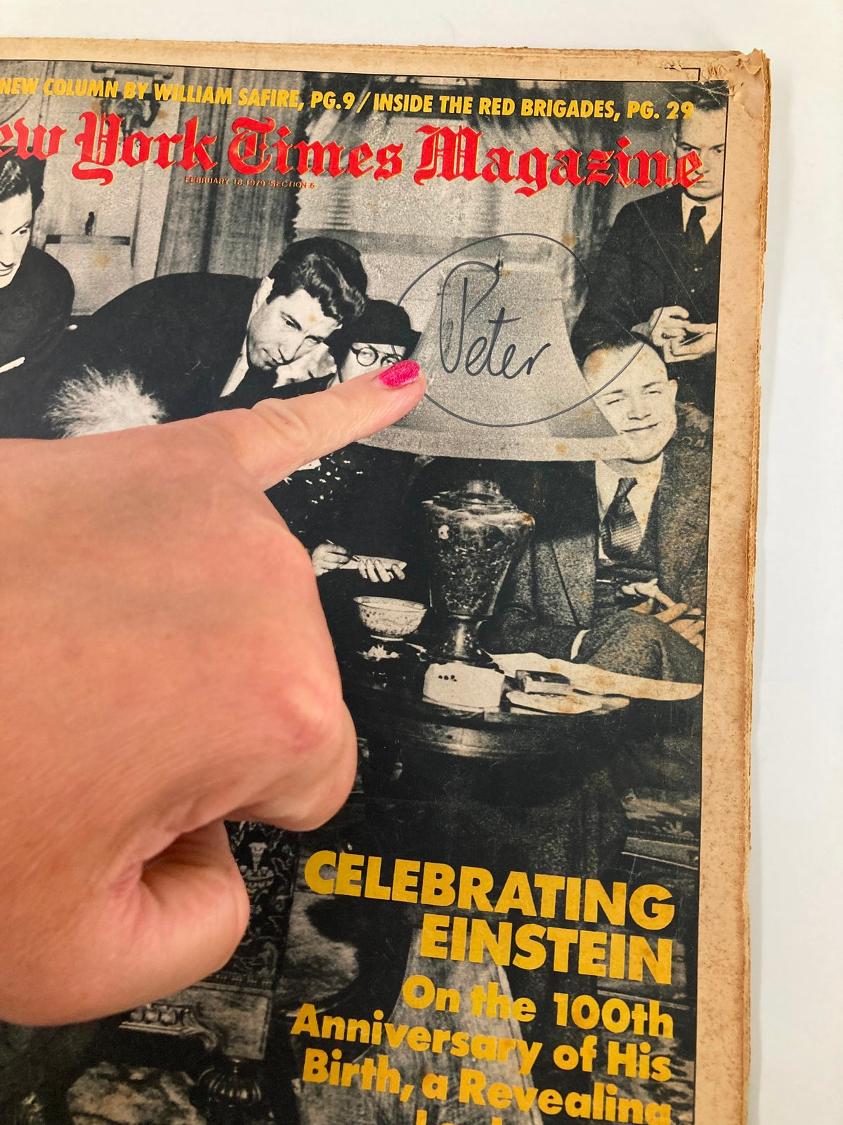 Close-up of VTG The New York Times Magazine cover from February 18, 1979, highlighting the celebration of Einstein, with a hand pointing to the signature 'Peter' and details of the magazine's title and anniversary tribute.