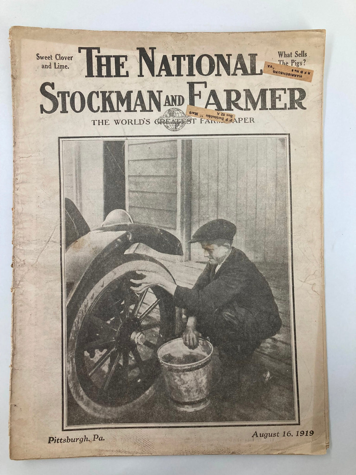 Cover of VTG The National Stockman and Farmer magazine from August 16, 1919, showing a farmer working on a wheel and a bucket. The magazine features the label 'Sweet Clover and Lime'.