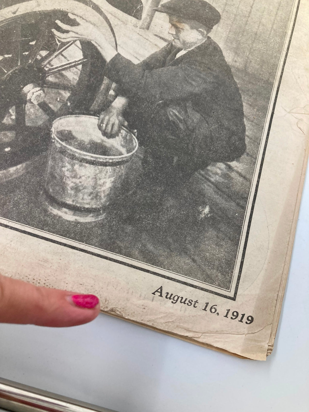 Detail of the VTG The National Stockman and Farmer magazine showing the publication date 'August 16, 1919' with a finger pointing at the date.
