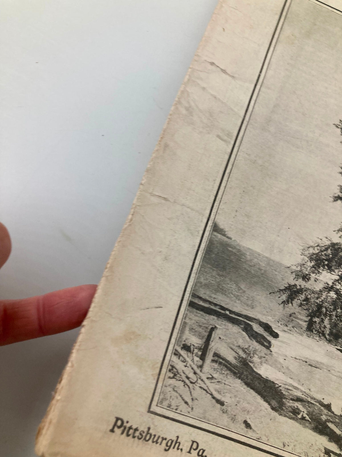 Close-up of the edge of VTG The National Stockman and Farmer magazine, dated October 11, 1919, highlighting the wear and tear that adds to its vintage character.