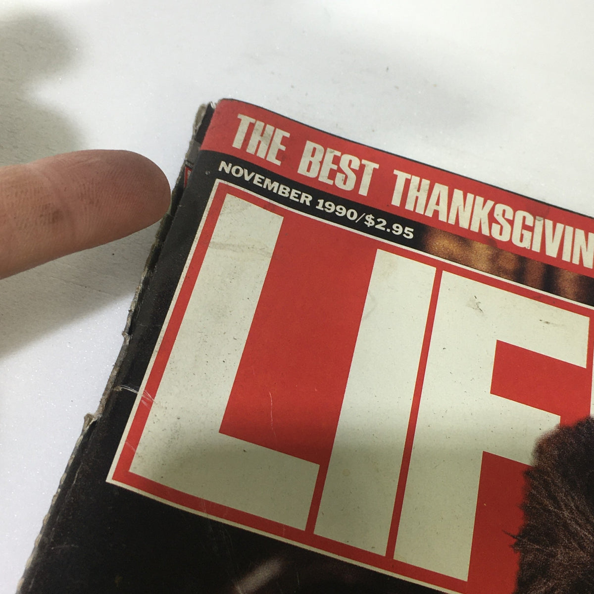 Close-up of the November 1990 cover of Life Magazine featuring the title 'LIFE' prominently displayed, highlighting a vintage issue related to Al Pacino's Godfather III after 16 years, showcasing the magazine's significance for collectors and film enthusiasts.