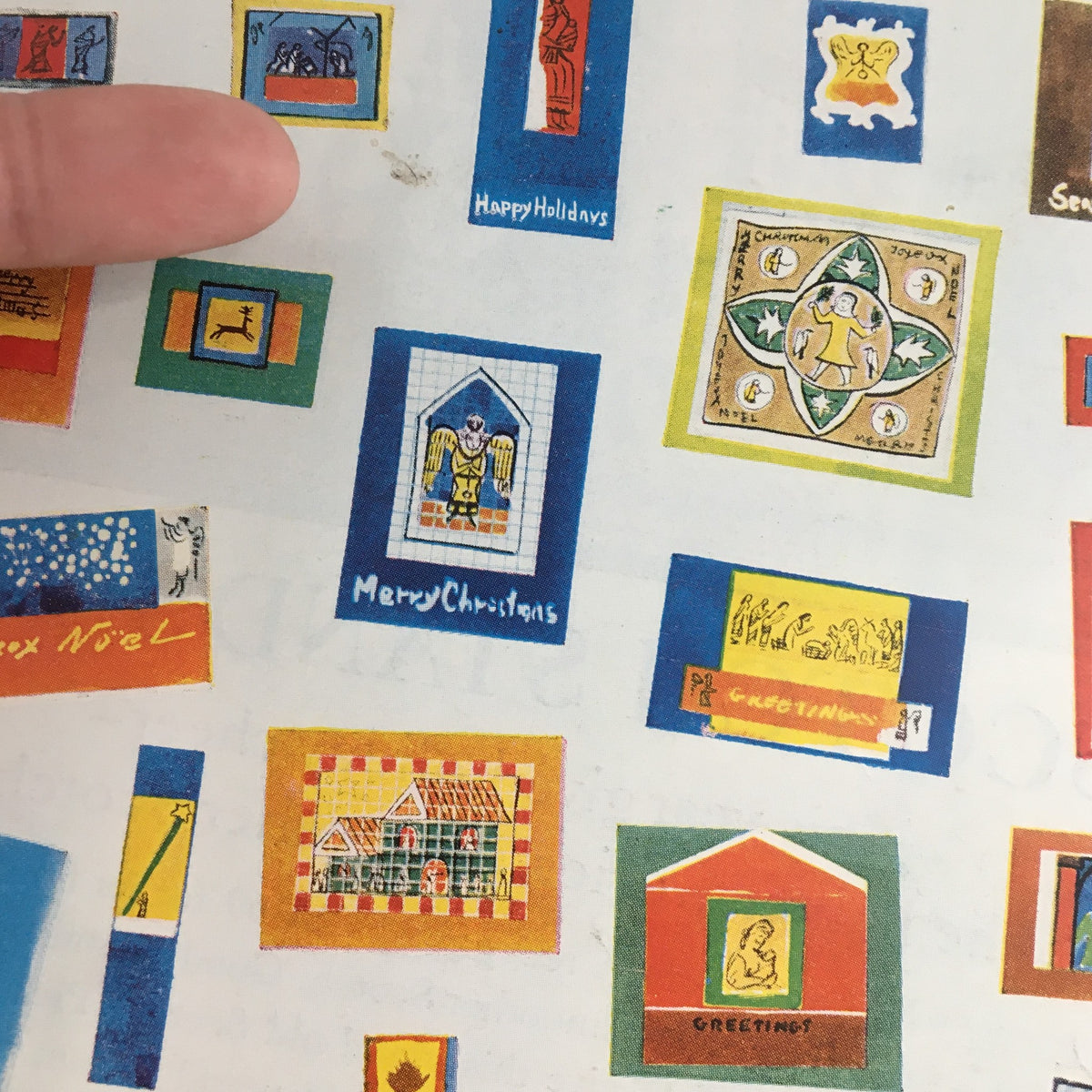 Detailed view of The New Yorker December 13 1958 cover art by Anatol Kovarsky, featuring an assortment of colorful and festive illustrated frames with holiday greetings.