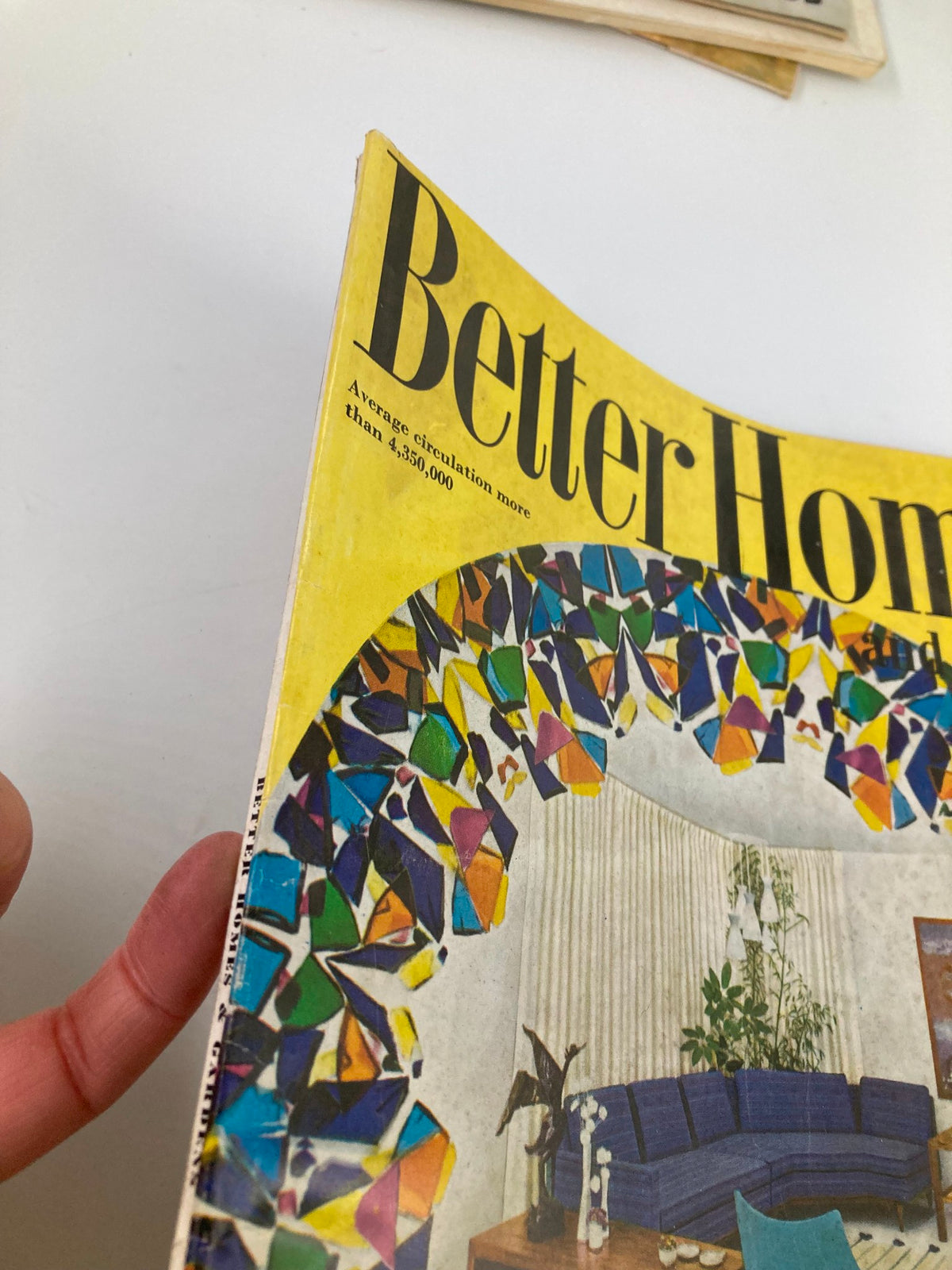 Side view of the VTG Better Homes and Gardens Magazine August 1957 highlighting the colorful cover design.