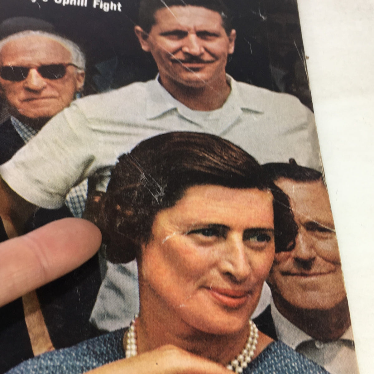 Detailed view of the cover of VTG Life Magazine June 26, 1964 highlighting the facial expressions of individuals including a woman wearing pearls, with the title 'The Scrantons A Family's Uphill Fight' visible.
