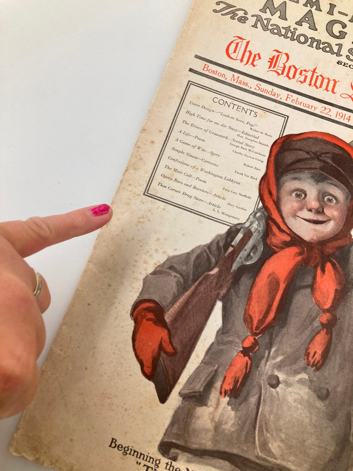 Detailed view of the cover of the VTG The Sunday Magazine from February 22, 1914, emphasizing the contents section with a focus on the boy holding a rifle.