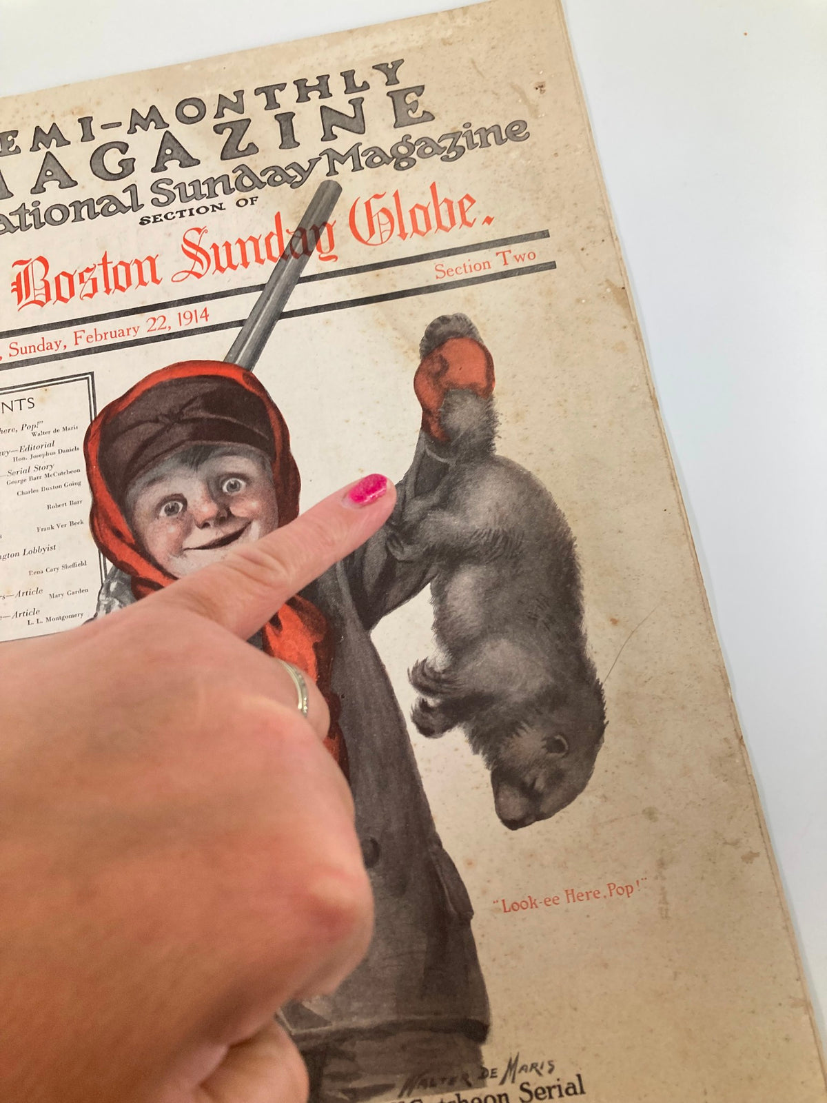 Close-up of the VTG The Sunday Magazine from February 22, 1914, highlighting the boy with a rifle and a captured fur, indicating 'Look ee Here, Pop!'