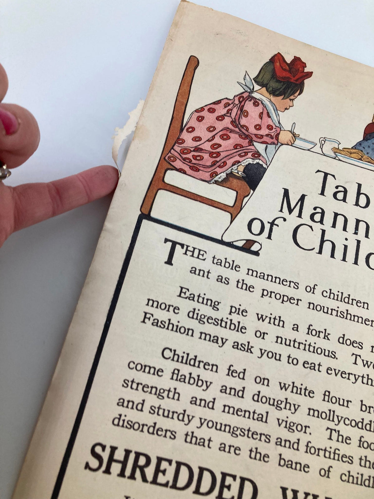 Close-up of children in VTG The Sunday Magazine June 21 1908 learning table manners, highlighting details of the Shredded Wheat advertisement.