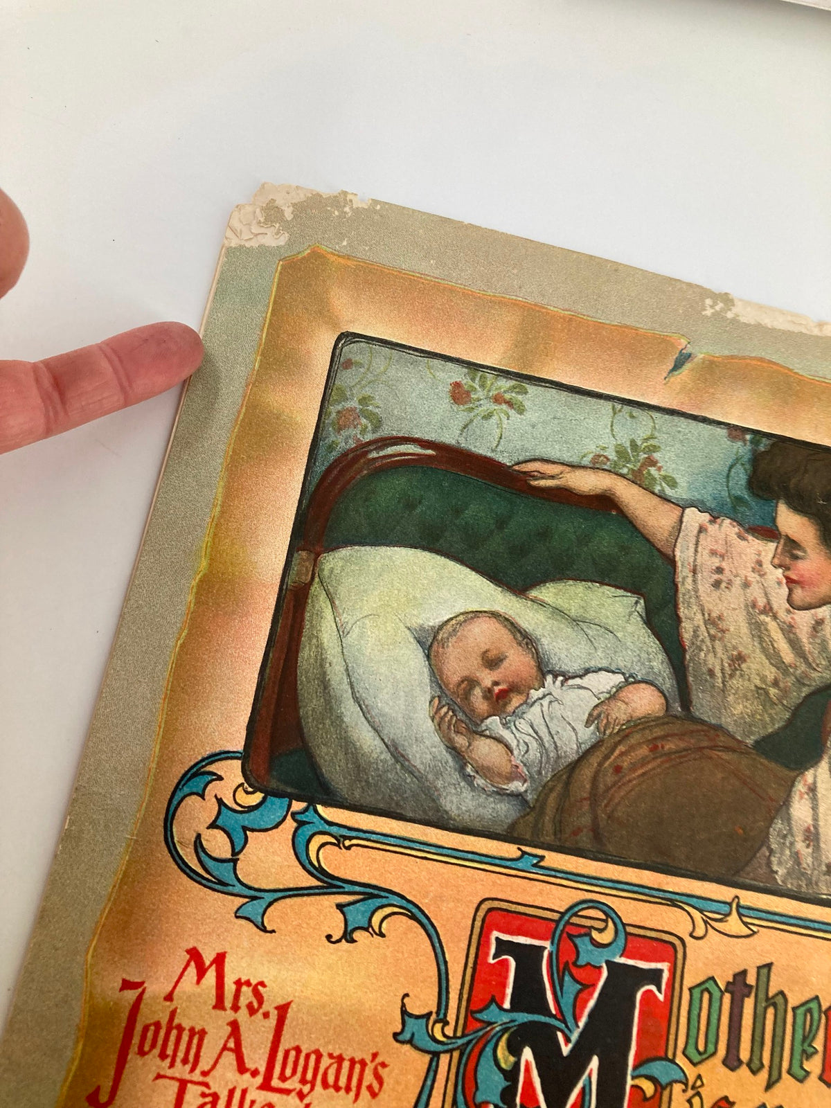 Close-up detail of the cover of 'VTG The Sunday Magazine November 27 1904', highlighting the delicate edges and wear, focusing on the mother and baby illustration.