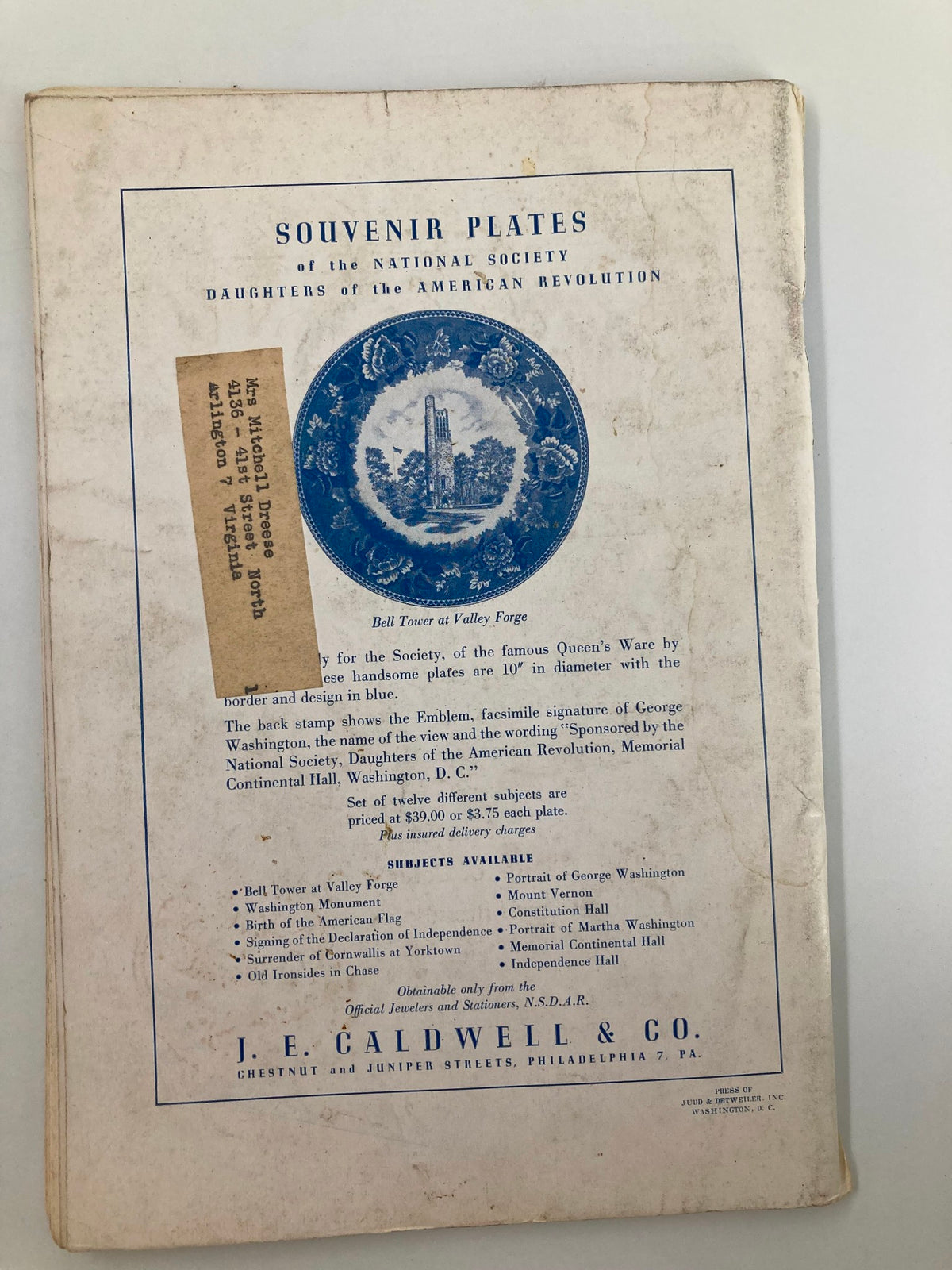 Back cover of the Daughters of the American Revolution Magazine April 1958, displaying information about souvenir plates associated with the organization. The nostalgic design emphasizes American heritage and history.