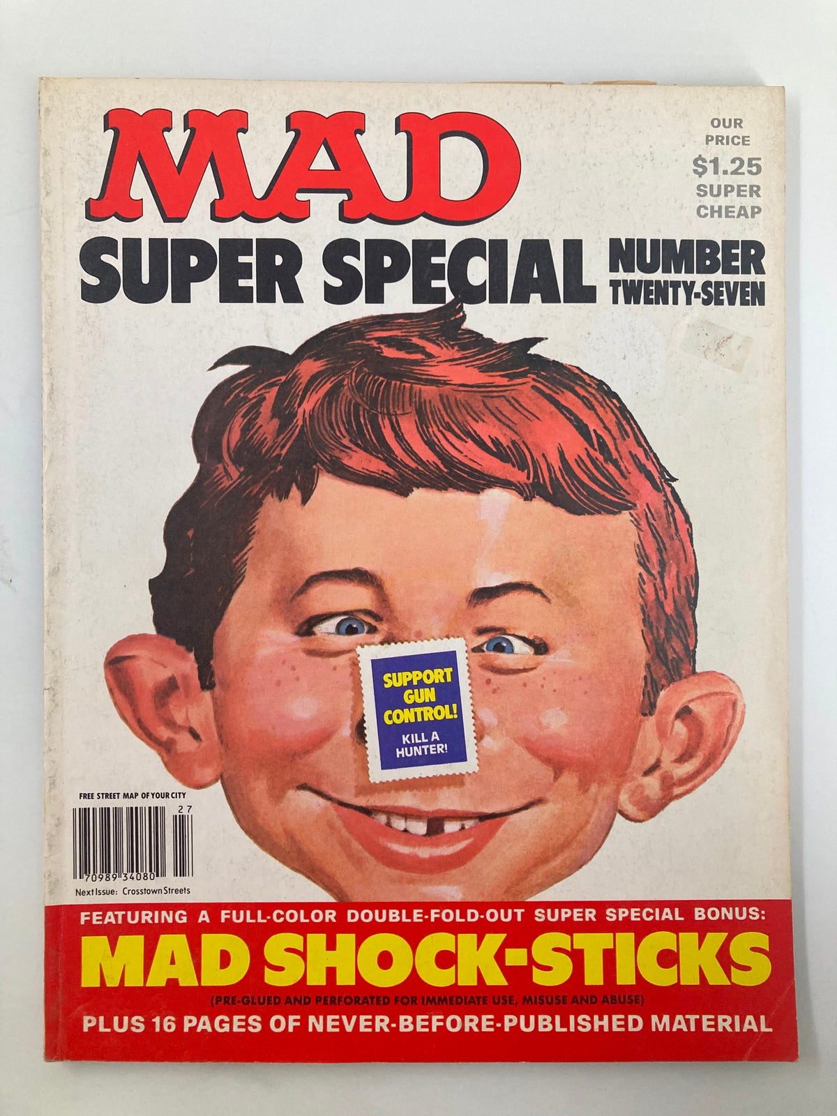 Cover of Mad Magazine 1978 No. 27 featuring a humorous illustration of a child with red hair, boldly displaying the message 'Support Gun Control: Kill a Hunter' alongside the Mad logo.