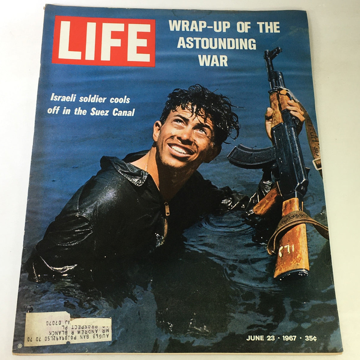 Cover of VTG Life Magazine July 23 1967 - Wrap-Up Of The Astounding War featuring an Israeli soldier cooling off in the Suez Canal, surrounded by water, showcasing military life during the war.