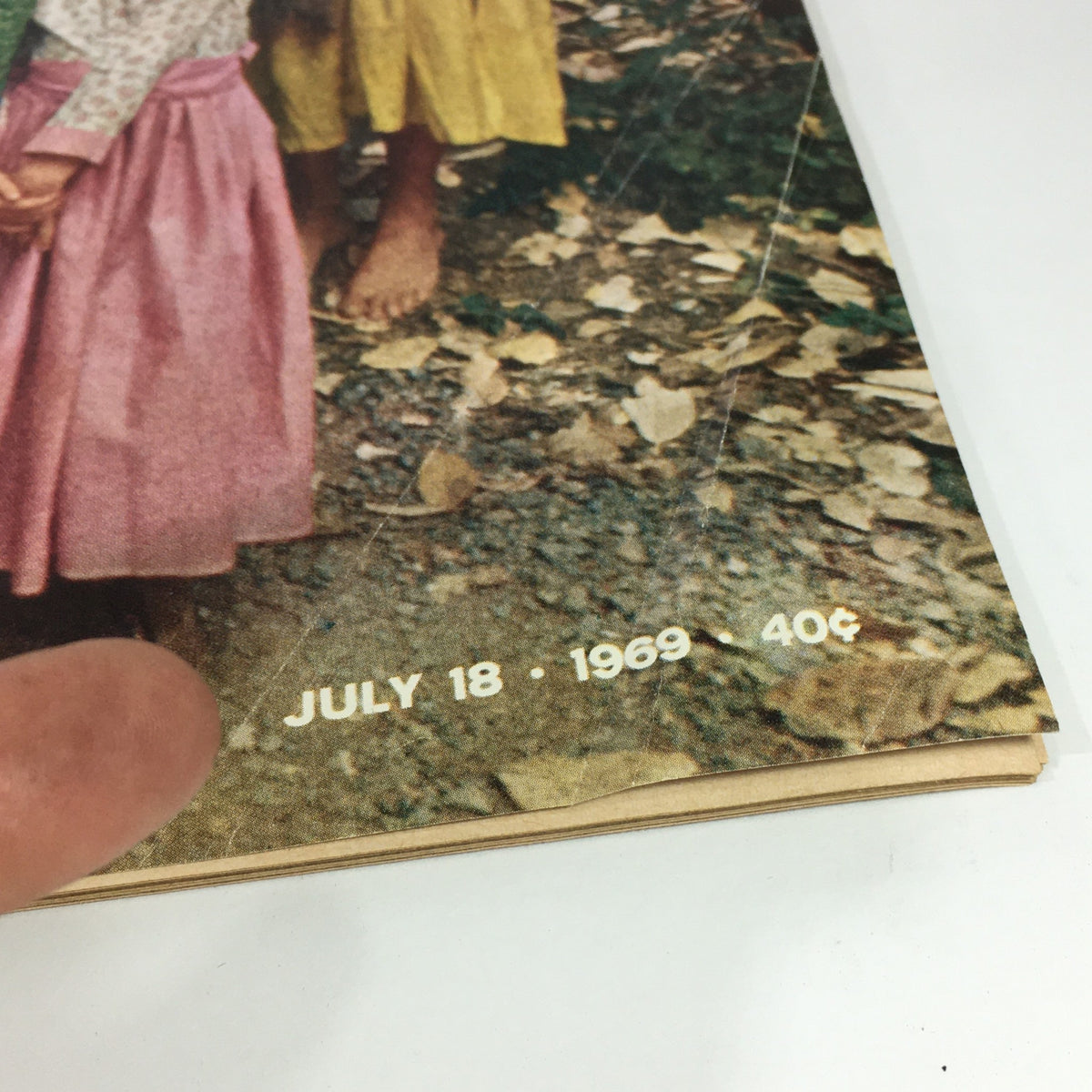 Close-up of the bottom corner of the vintage Life Magazine from July 18, 1969, showing the date 'JULY 18 1969' and the price '40¢', part of the issue titled 'The Youth Communes: New Way of Living Confronts the U.S.'.