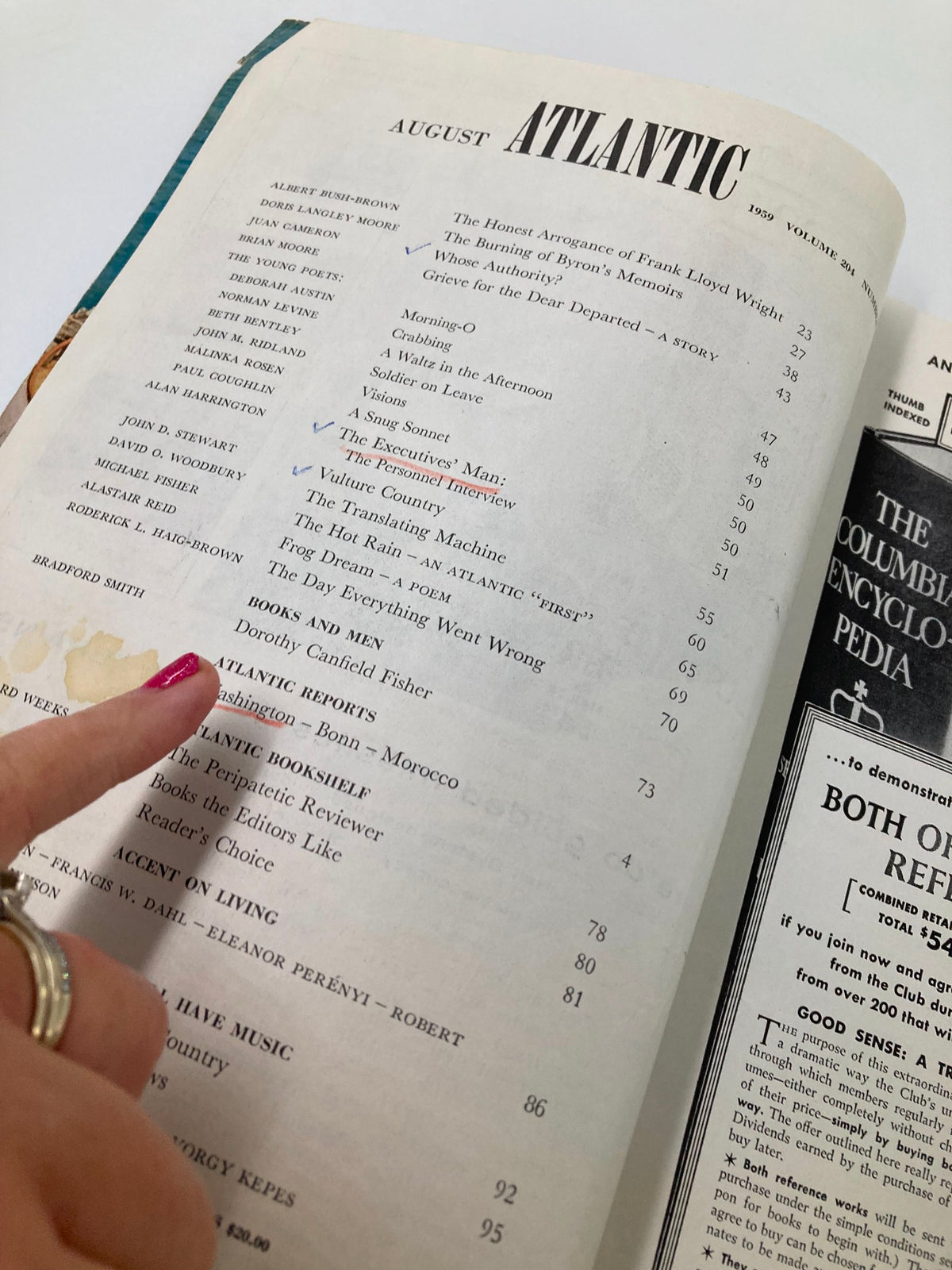 Inner page of VTG The Atlantic Magazine August 1959 featuring a reader's hand pointing to the table of contents which includes 'The Burning of Byron's Memoirs'.