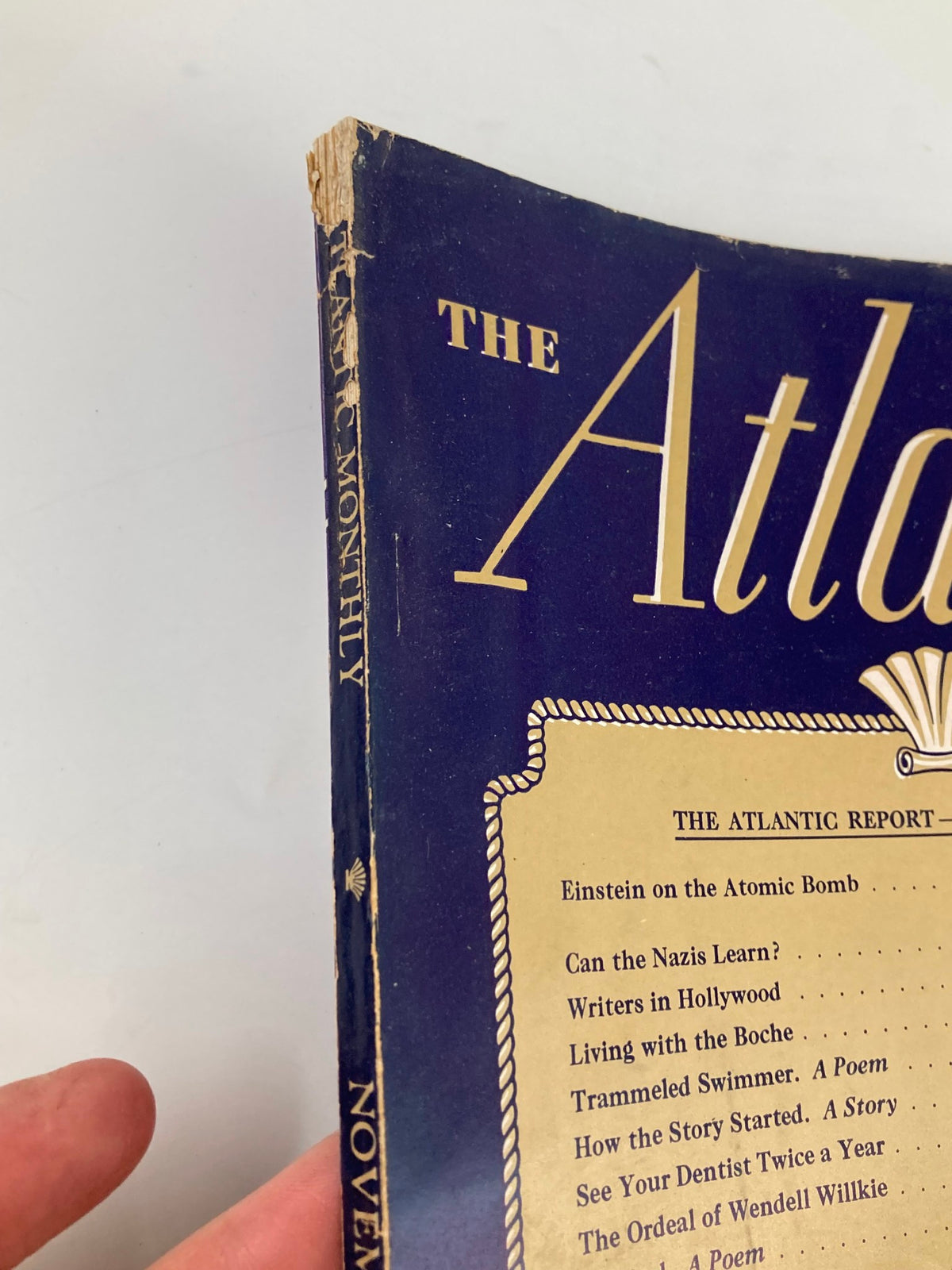 Close-up view of the side spine of VTG The Atlantic Magazine November 1945, displaying minor wear and aging, emphasizing its vintage condition.