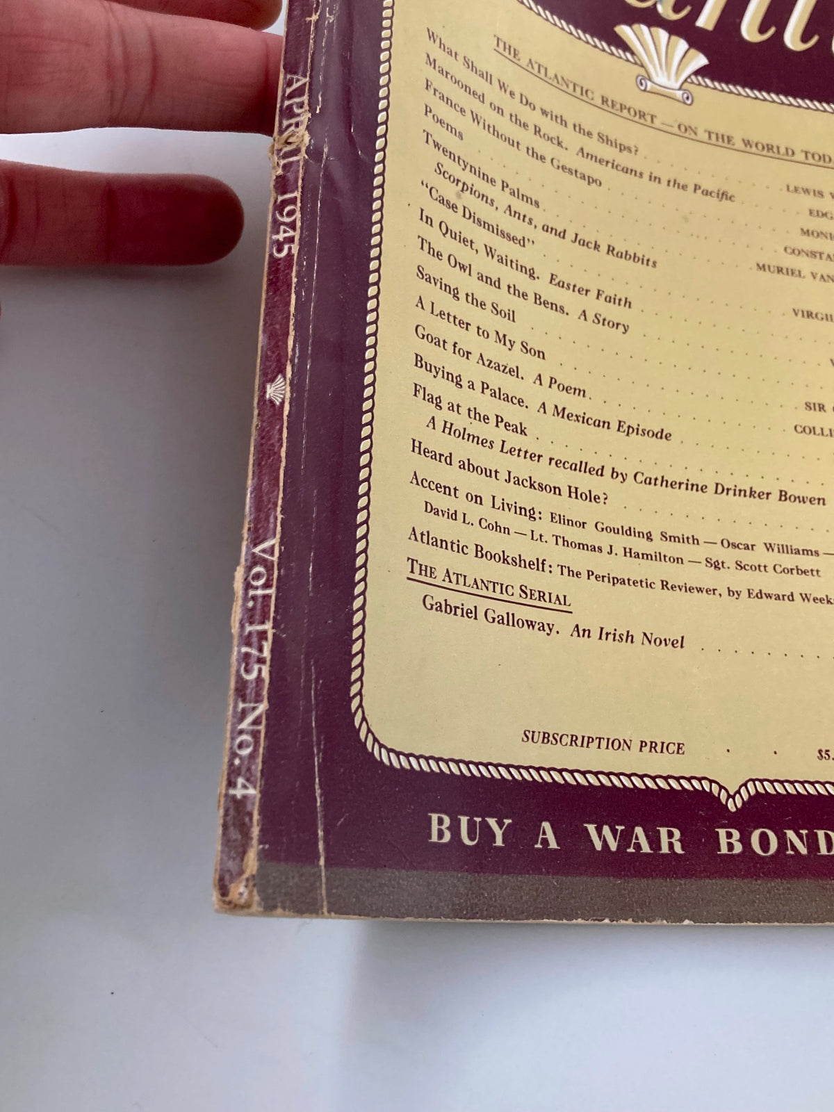 Close-up of the spine of VTG The Atlantic Magazine April 1945 highlighting the publication date and condition, representing vintage collectible literature.