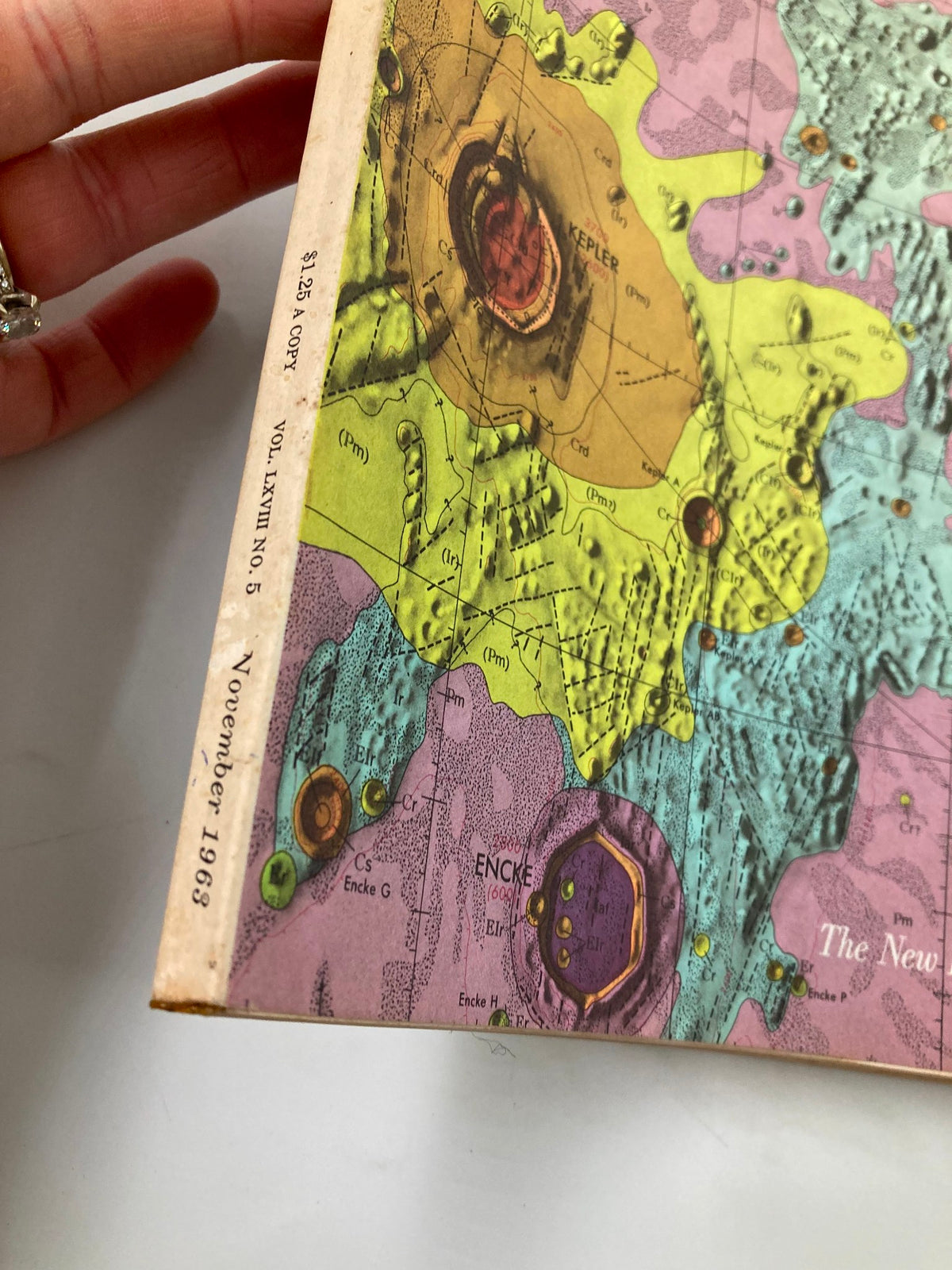 Side view of the VTG Fortune Magazine November 1963 showcasing the publication date and pricing on the spine, with a colorful lunar map background.