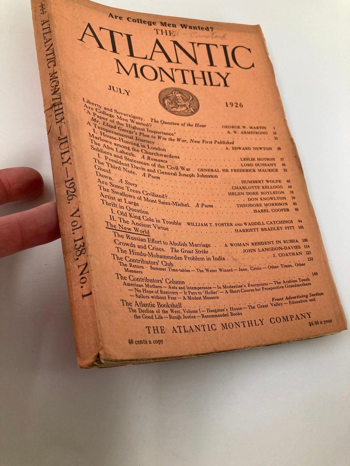 Side view of the July 1926 The Atlantic Monthly magazine held in hand, highlighting the worn cover design and vintage features.