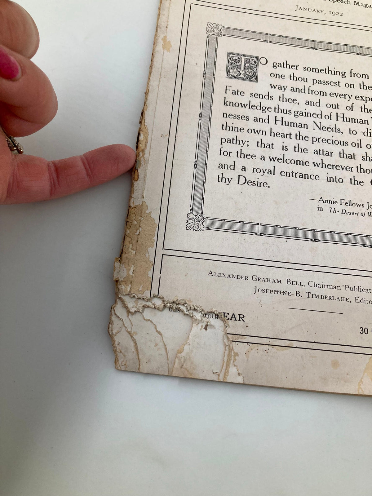 Detail of VTG Volta Review Magazine January 1922 showing edge wear and tear, emphasizing its vintage character.