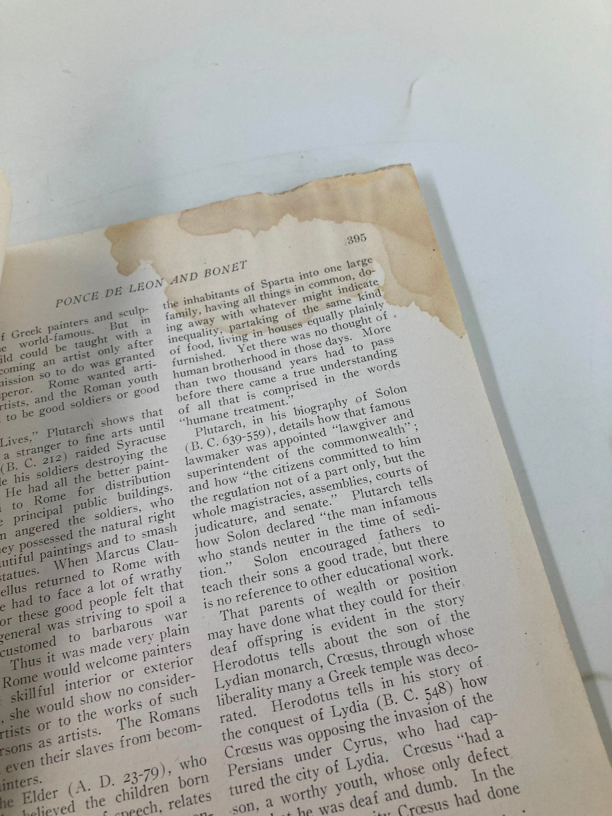 Interior page of VTG Volta Review Magazine July 1920, featuring historical text with water damage.