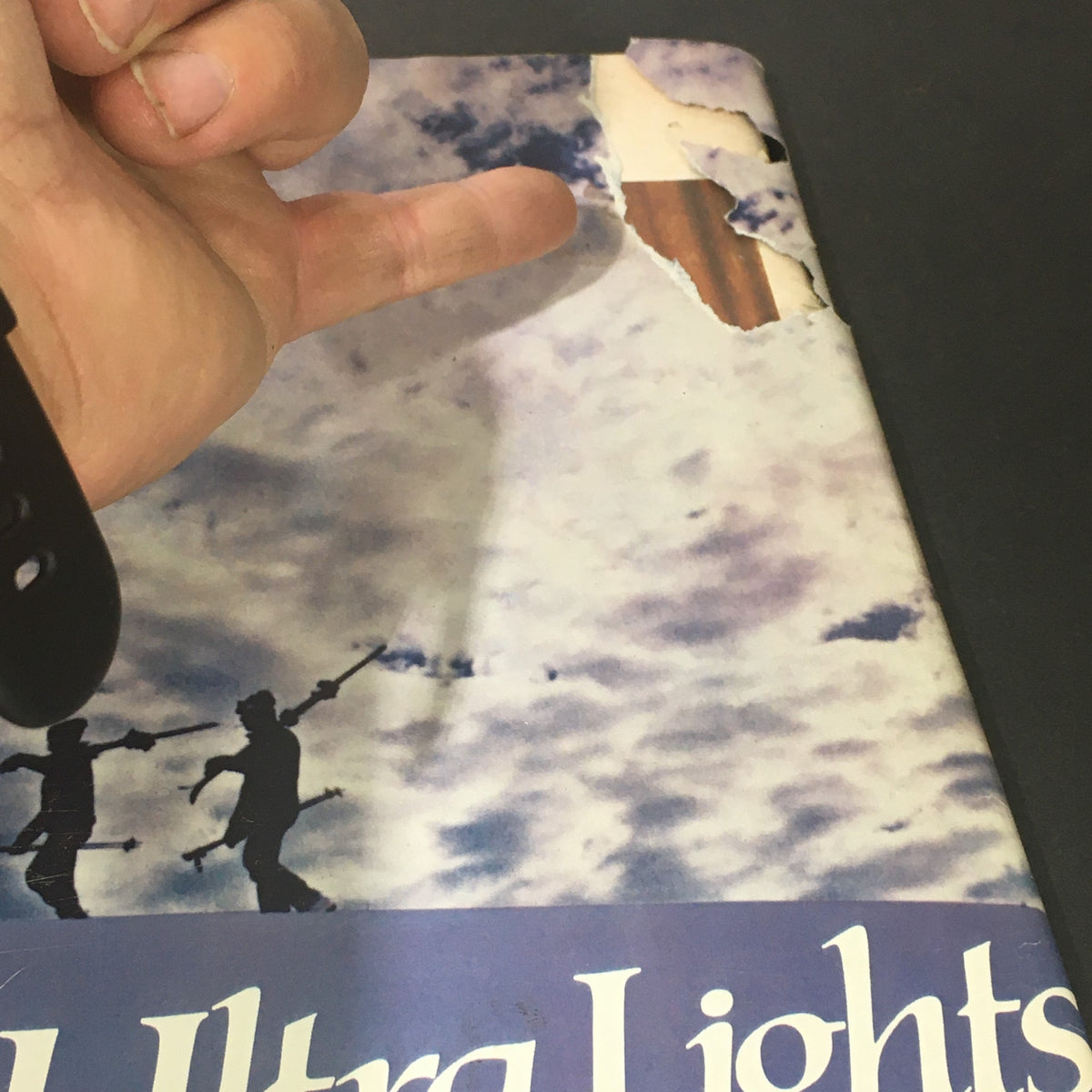 Detail of a torn page from the January 1983 Life Magazine that showcases the Vantage Ultra Lights branding with cloudy background.