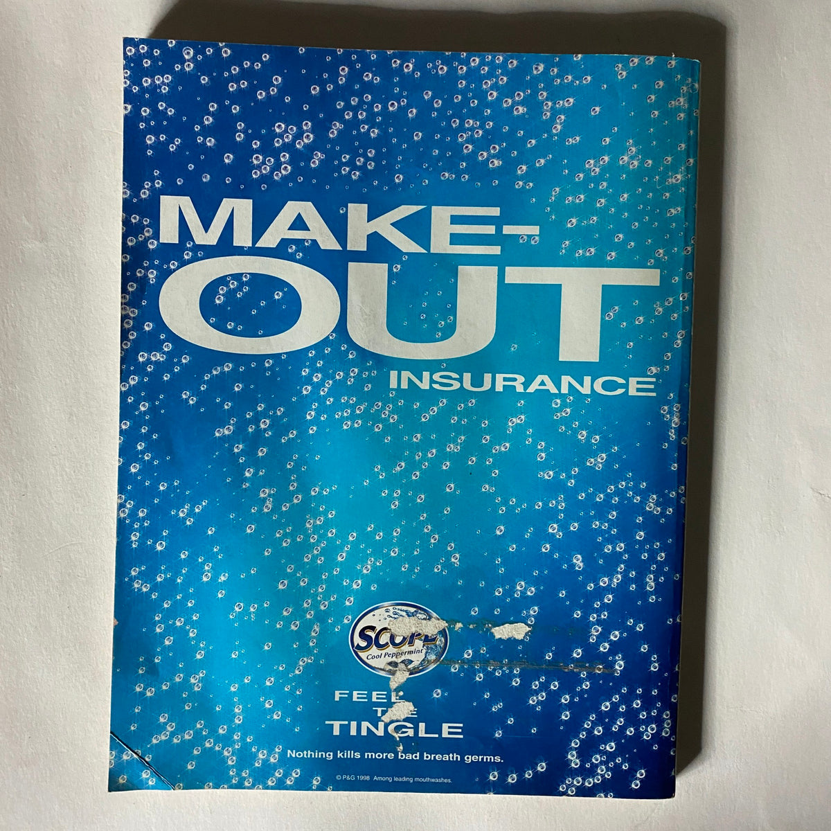 Back cover of Muscle & Fitness Magazine November 1998 advertising 'Make-Out Insurance' with a blue background and bubbles, reinforcing the magazine's vibrant theme.