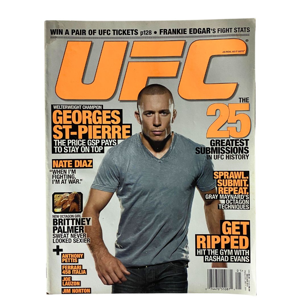 UFC Magazine December / January 2011 No. 8 featuring Georges St. Pierre on the cover, showcasing the welterweight champion with headlines about greatest submissions in UFC history and training advice.
