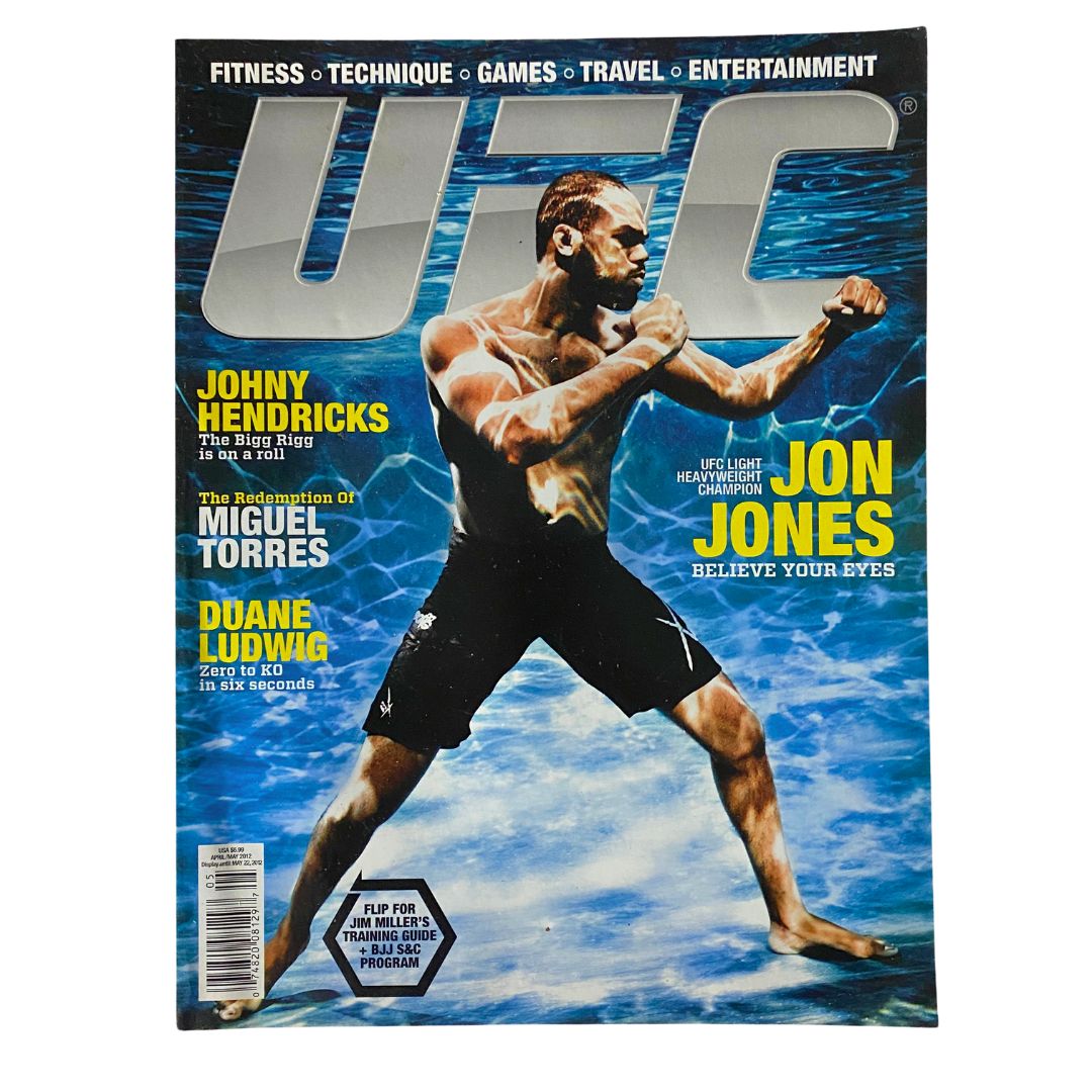 UFC Magazine April / May 2012 No. 14 featuring Jon Jones on the cover, showcasing the fighter in action against a vibrant blue water background. A collectible magazine for MMA enthusiasts.