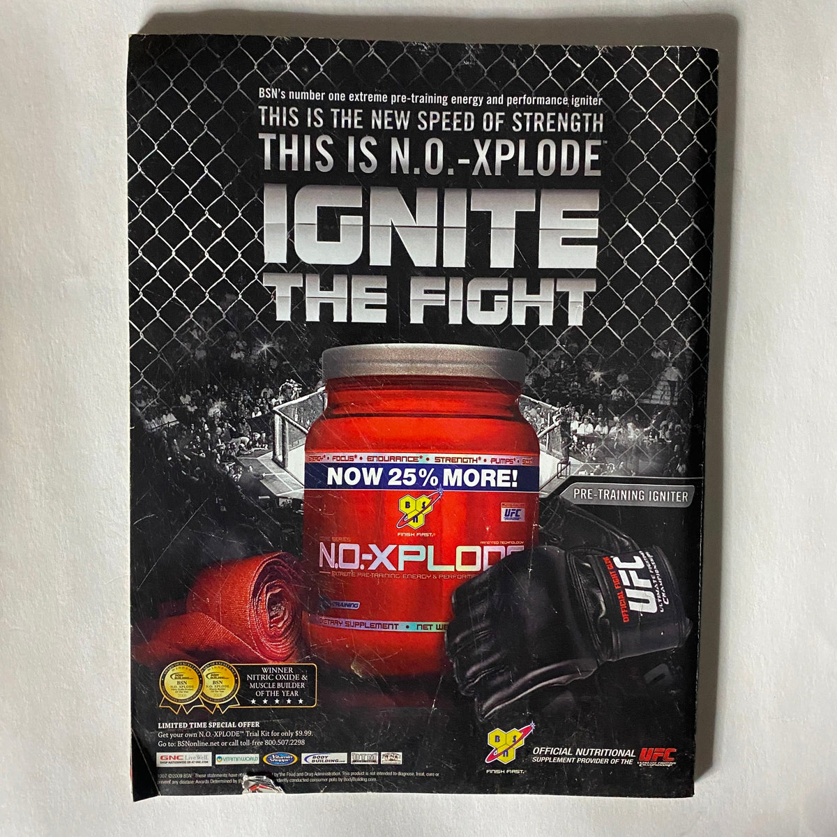 Advertisement for BSN's NO-Xplode pre-training supplement featured in UFC Magazine, promoting the slogan 'Ignite the Fight' along with a performance energy product.