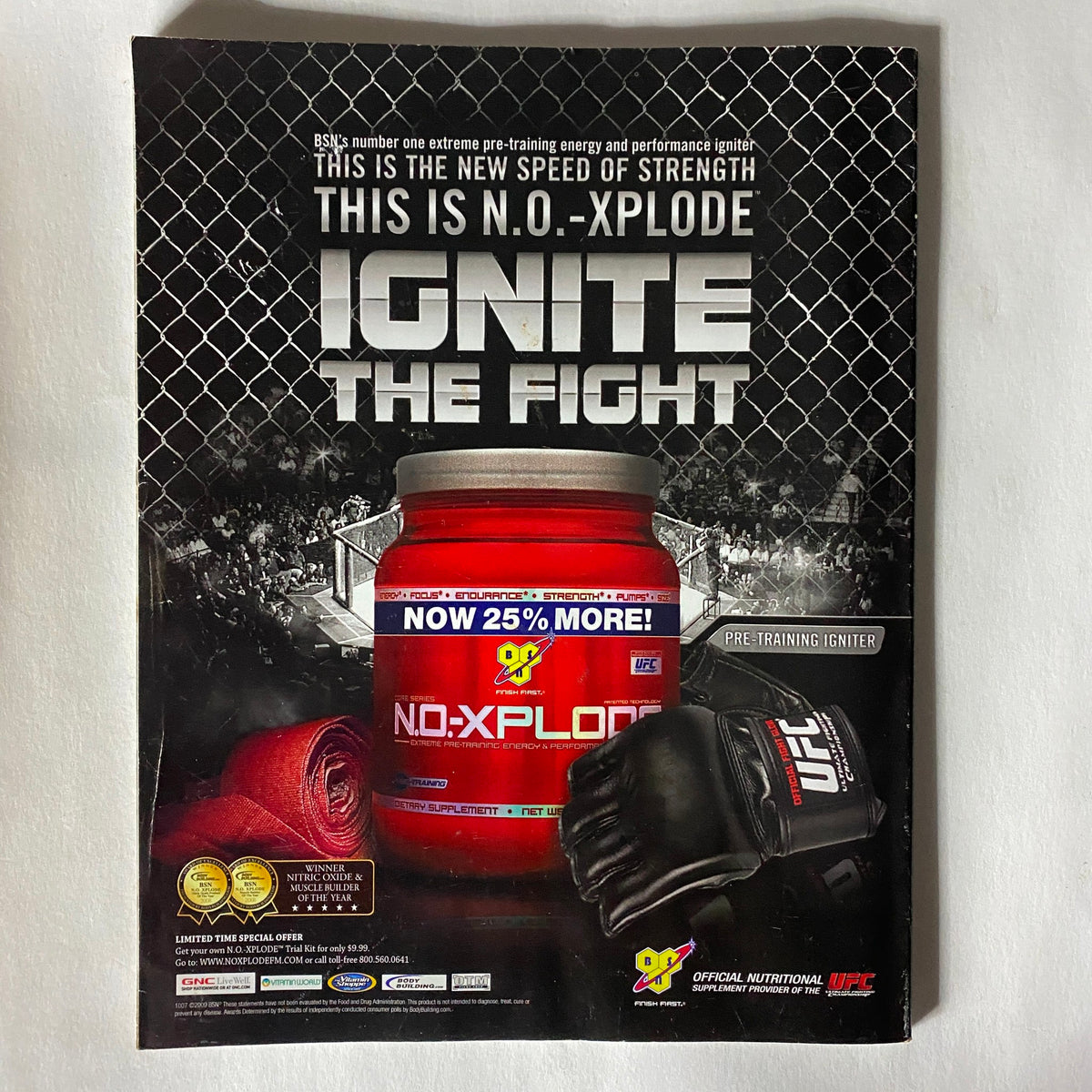 Back cover of Fight! Magazine June 2009, promoting N.O.-Xplode energy supplement, featuring UFC gloves and an engaging design related to MMA training.