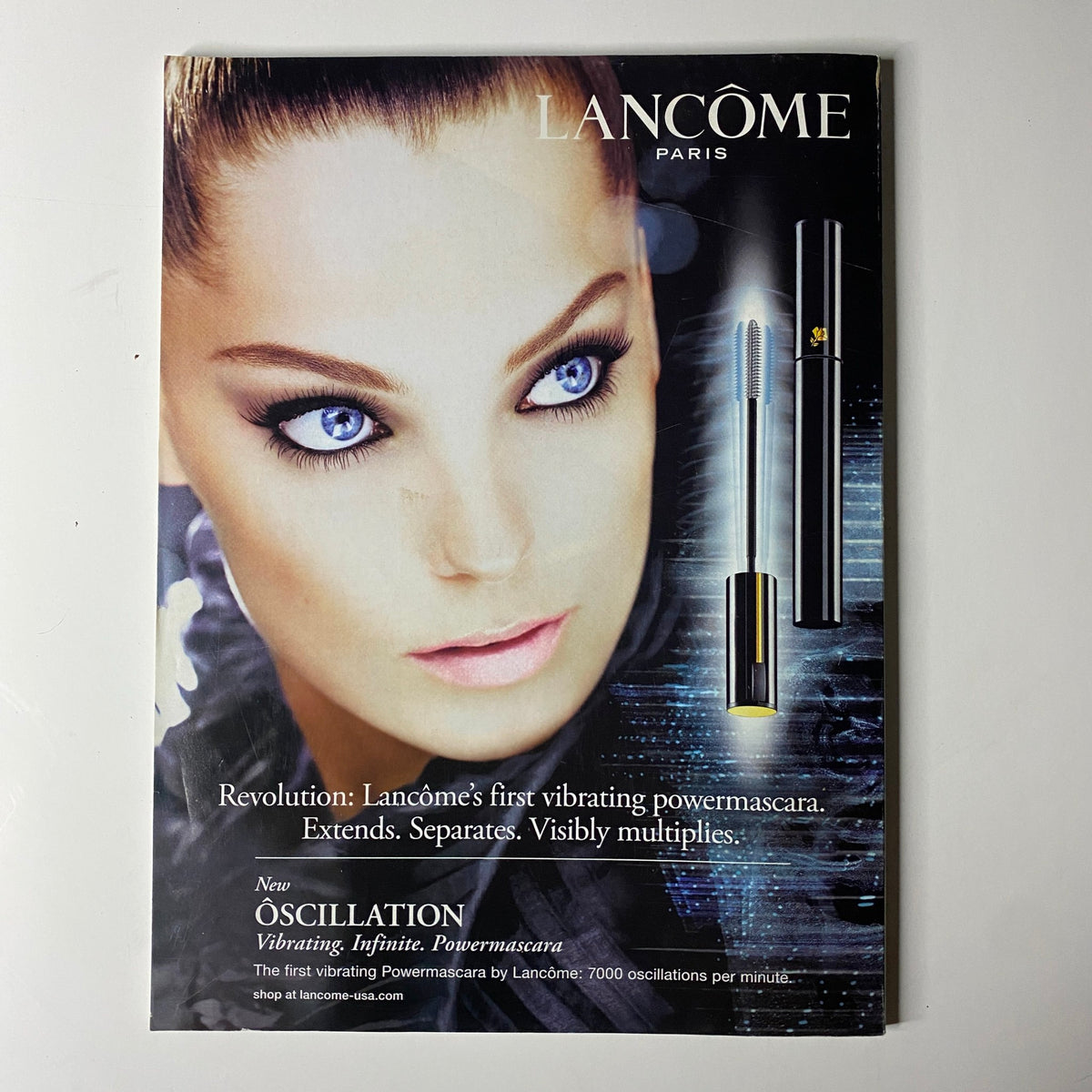 Advertisement from Vogue Magazine January 2009 for Lancôme's vibrating Powermascara, illustrating the beauty product's features and branding.