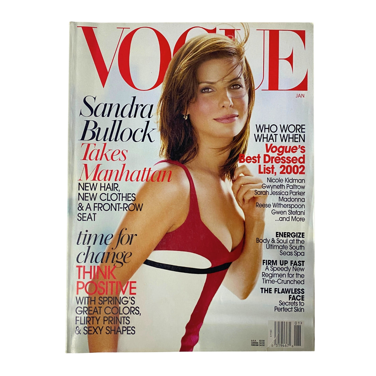Vogue Magazine January 2003 cover featuring Sandra Bullock in a stylish red dress, showcasing her elegance and charm as she graces the cover titled 'Sandra Bullock Takes Manhattan'. A must-have for fashion enthusiasts and collectors.