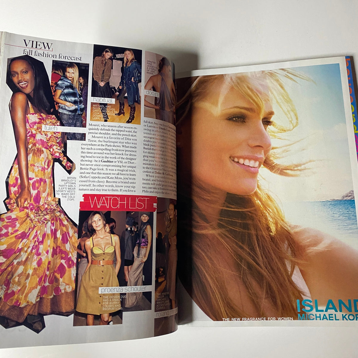 Inside view of Vogue Magazine June 2005 featuring a fall fashion forecast with models in stylish outfits and a layout showcasing fashion trends. This page captures the essence of the magazine's detailed exploration of fashion.