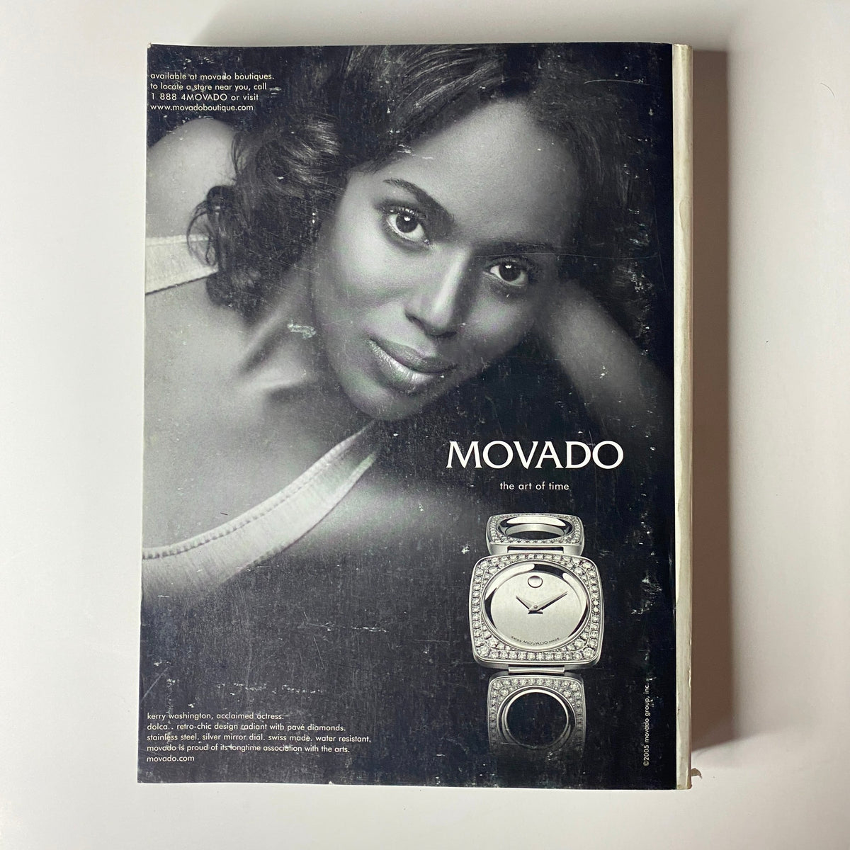 Advertisement for Movado watches in Vogue Magazine September 2005, showcasing a classic timepiece along with a beautiful model.