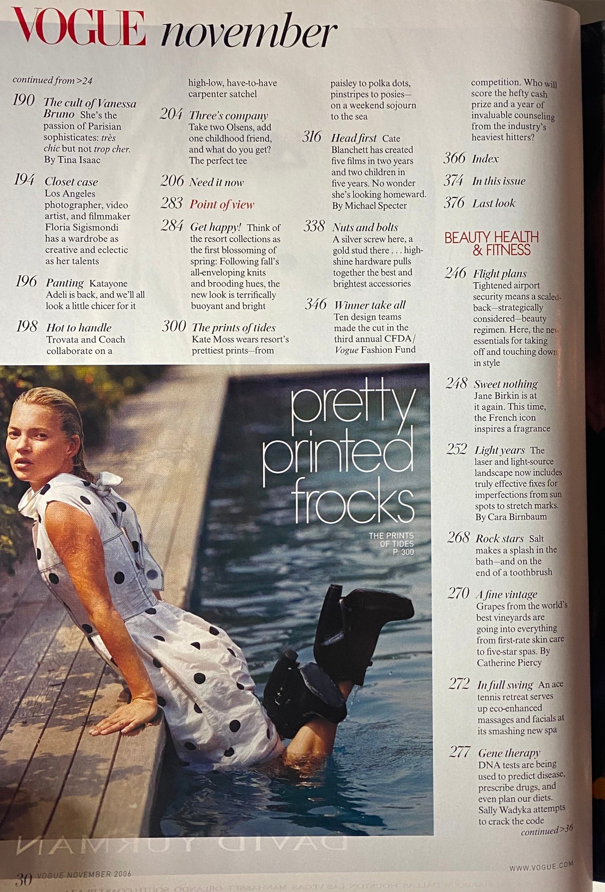 Vogue Magazine November 2006 featuring an editorial page with 'Pretty Printed Frocks' highlighting stylish dresses. Cover model showcases the latest high-fashion trends.