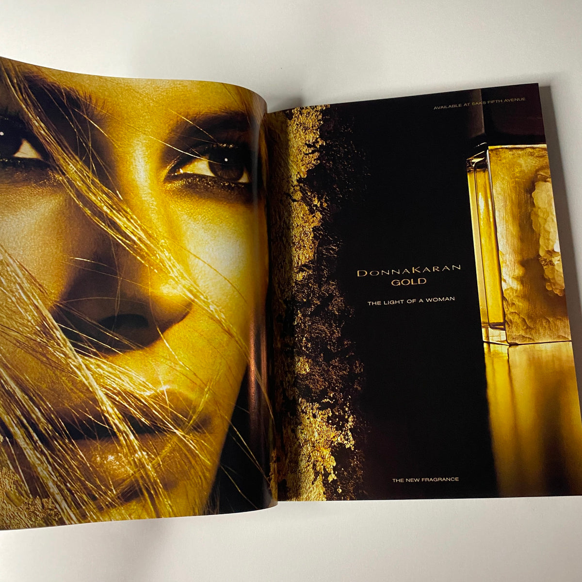 Vogue Magazine November 2006 featuring an advertisement for Donna Karan's fragrance, GOLD, with a focus on luxurious beauty and elegance.