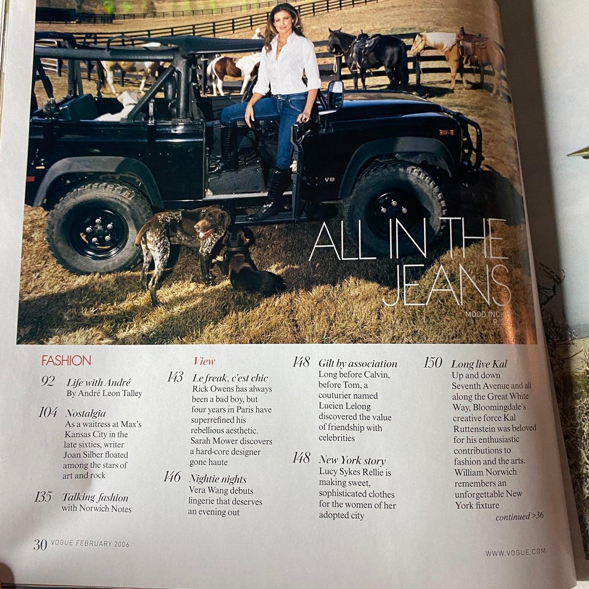 Inside page of Vogue Magazine February 2006 titled 'All in the Jeans,' featuring models and a rugged Jeep, emphasizing the vintage fashion trends of the early 2000s.