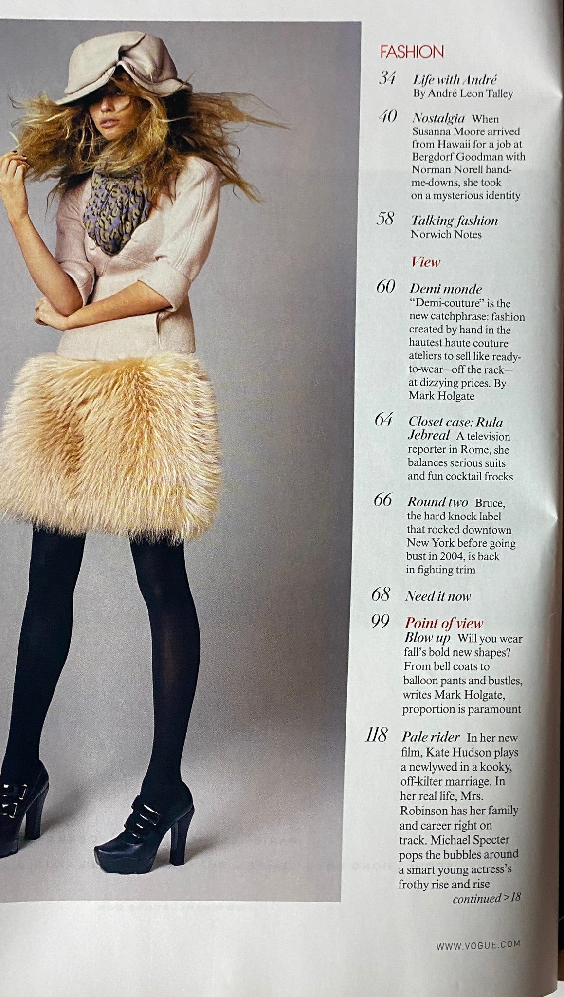 Inside spread of Vogue Magazine July 2006 featuring fashion articles including 'Life with André' and 'Nostalgia', with a model styled in muted colors and accessories.