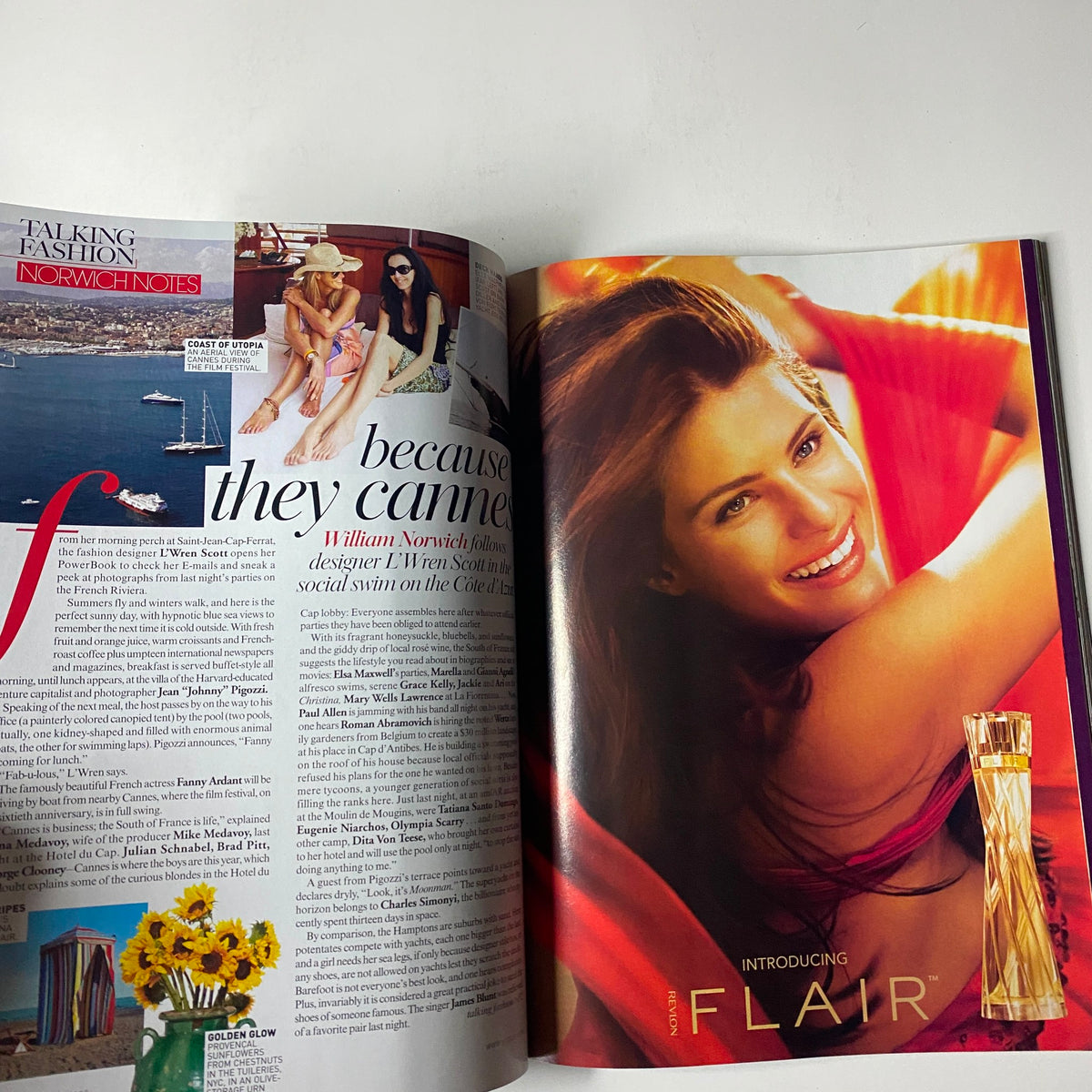Vogue Magazine August 2007, featuring an advertisement for Flair perfume, showcasing a radiant model with long flowing hair, emphasizing beauty and elegance in the fashion world.
